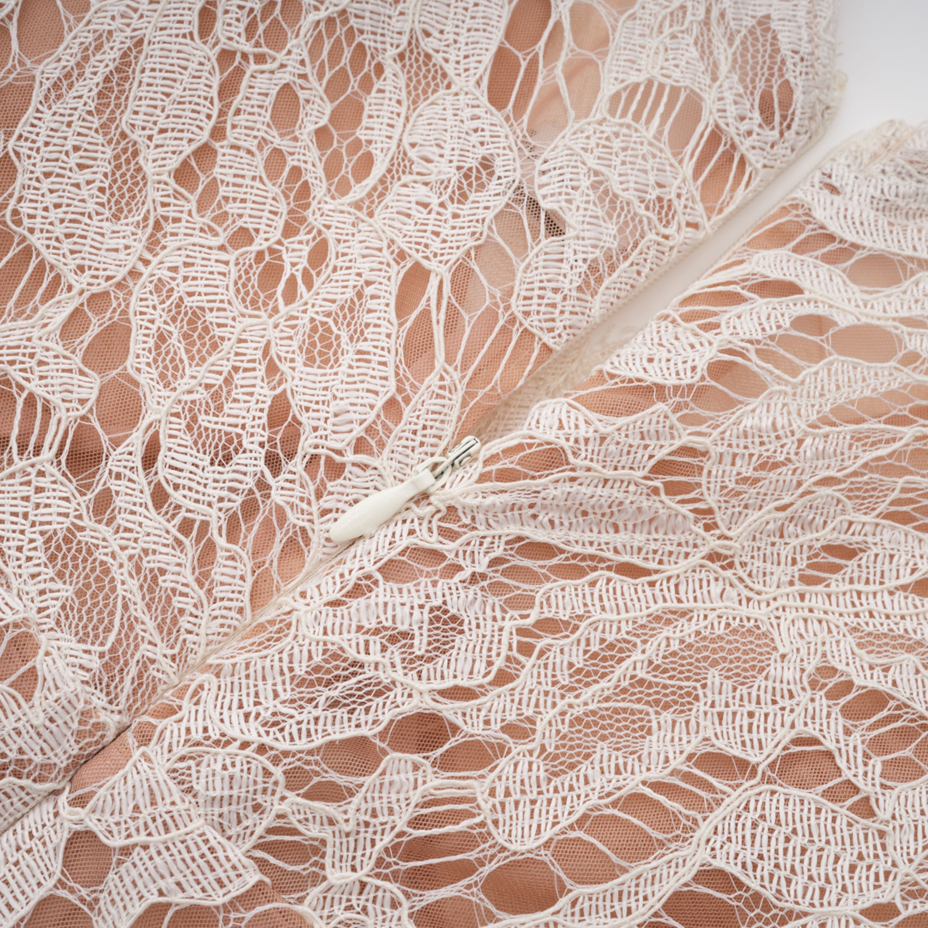 White lace midi dress with a keyhole neckline and a flared skirt over a nude lining