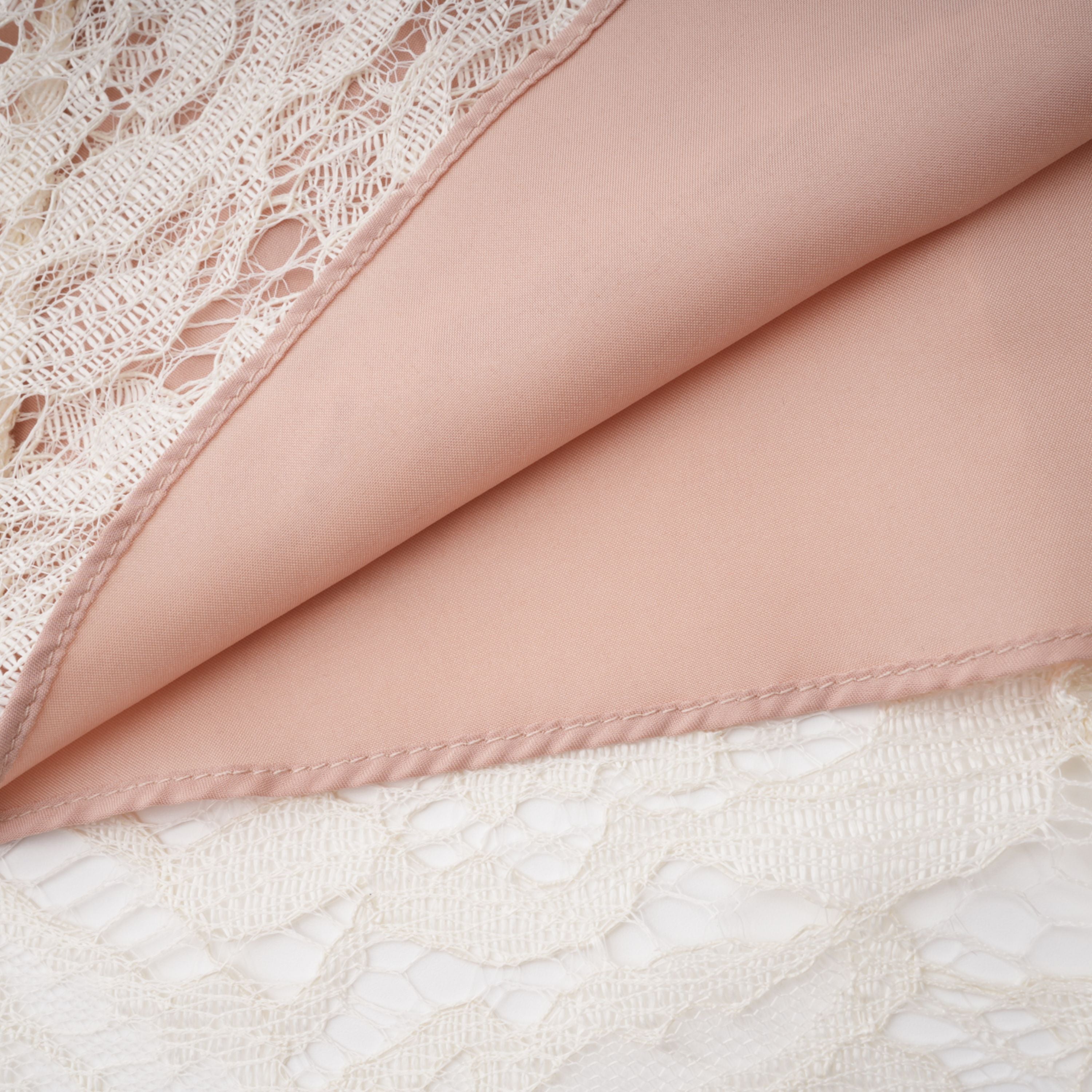 White lace midi dress with a keyhole neckline and a flared skirt over a nude lining