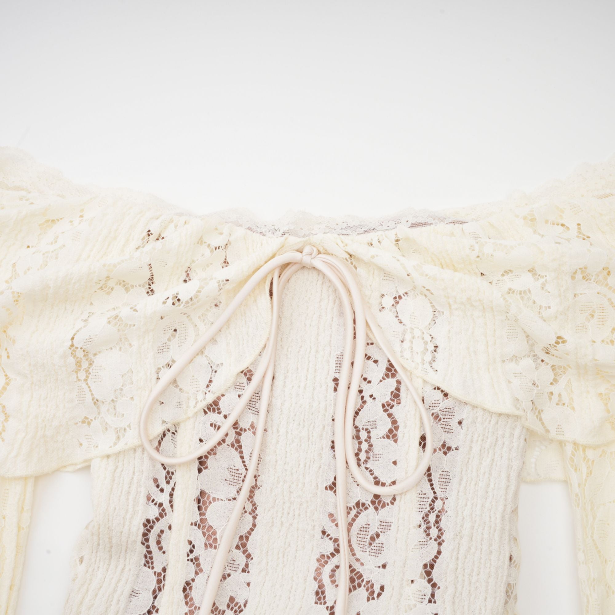 Cream off-the-shoulder lace gown with long bell sleeves