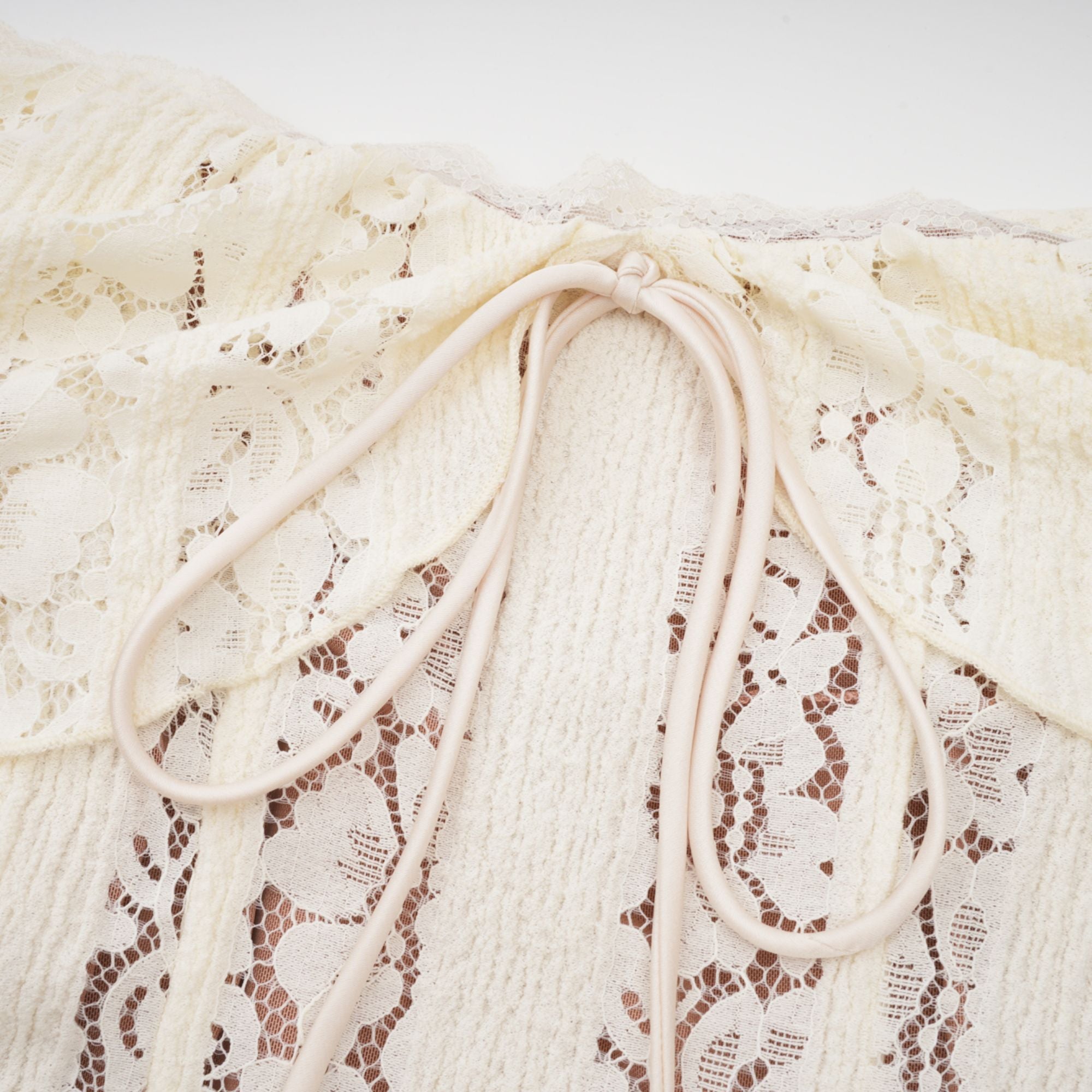 Cream off-the-shoulder lace gown with long bell sleeves