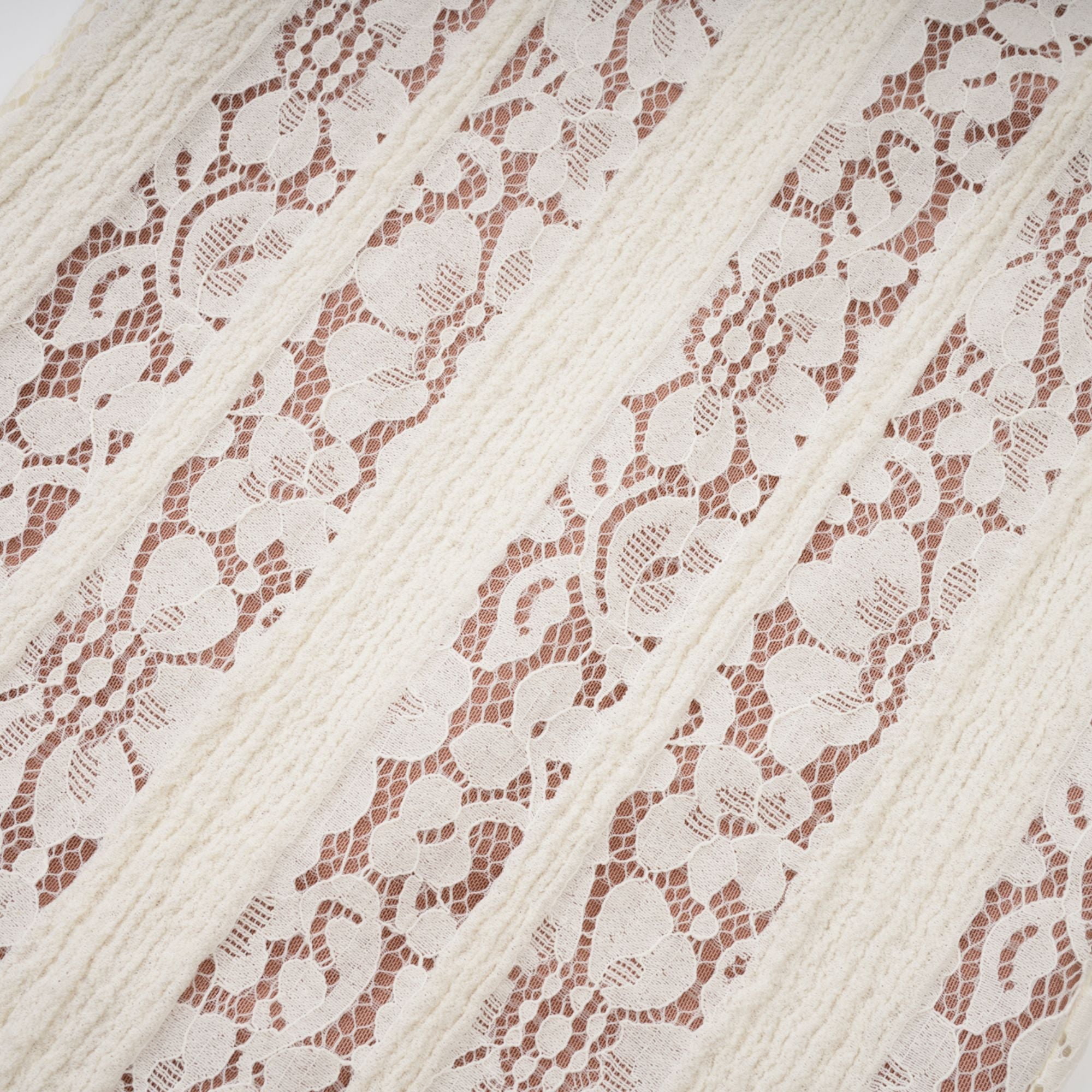 Cream off-the-shoulder lace gown with long bell sleeves