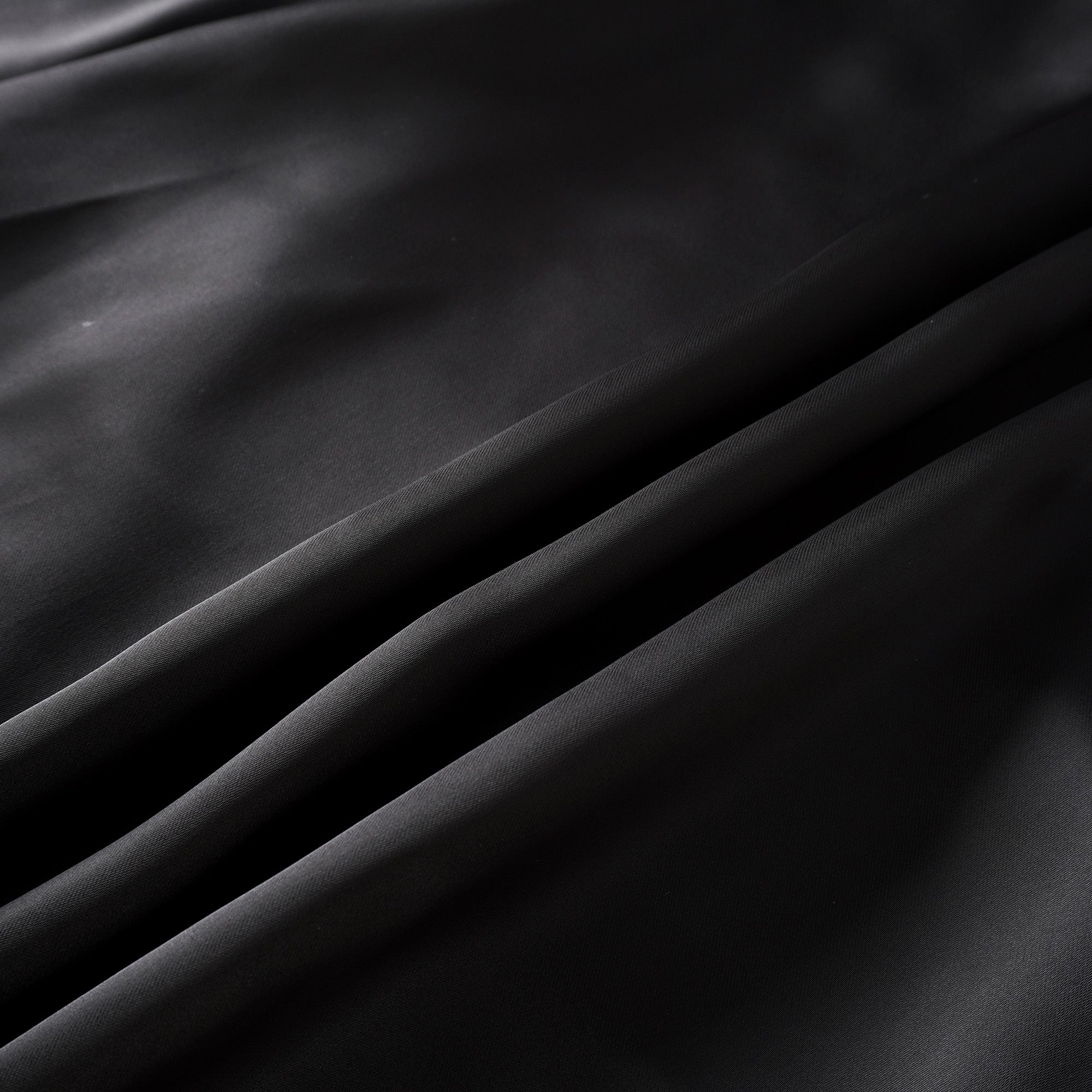 Black blazer paired with a black satin maxi skirt