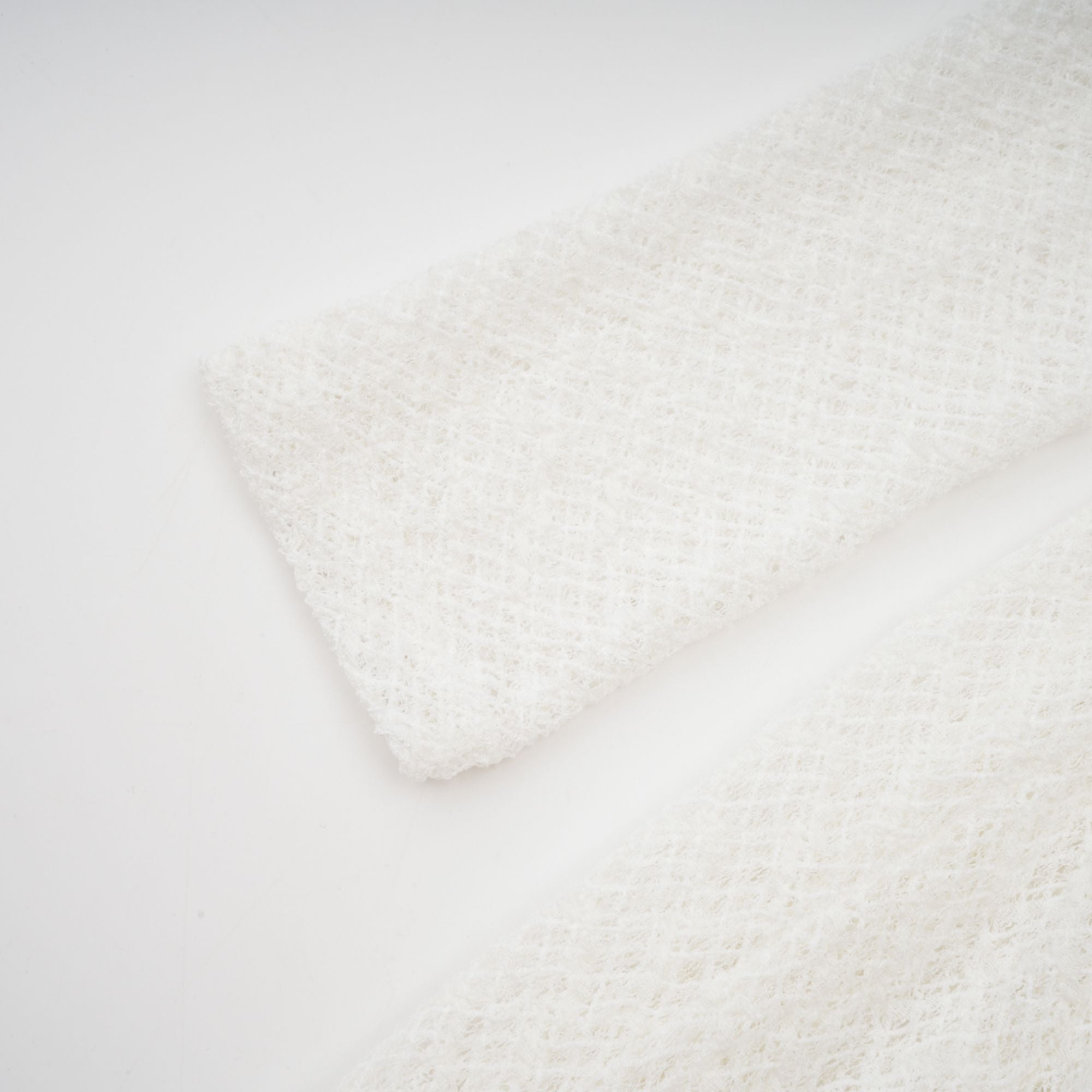 White long-sleeve textured knit gown with a high neck