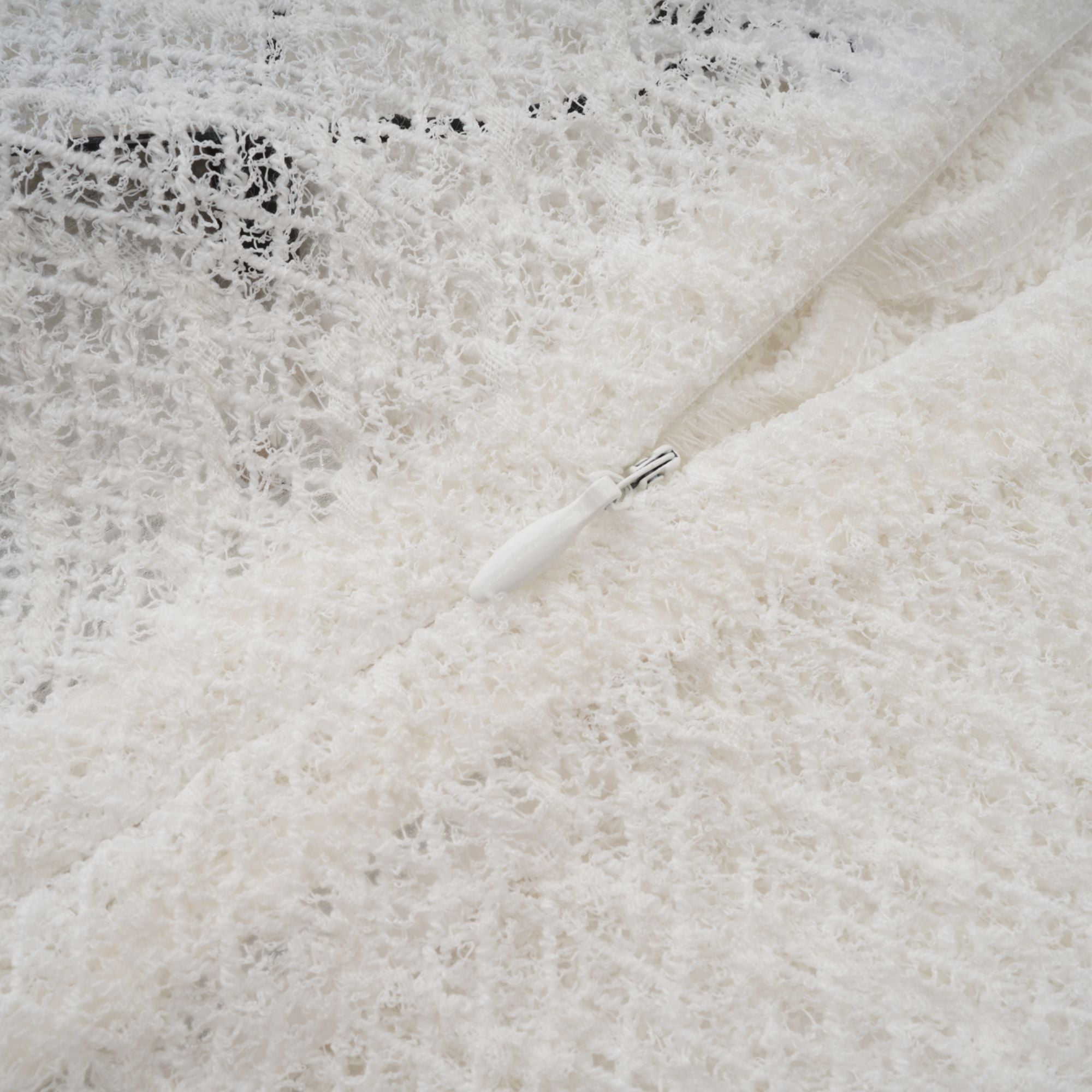 White long-sleeve textured knit gown with a high neck