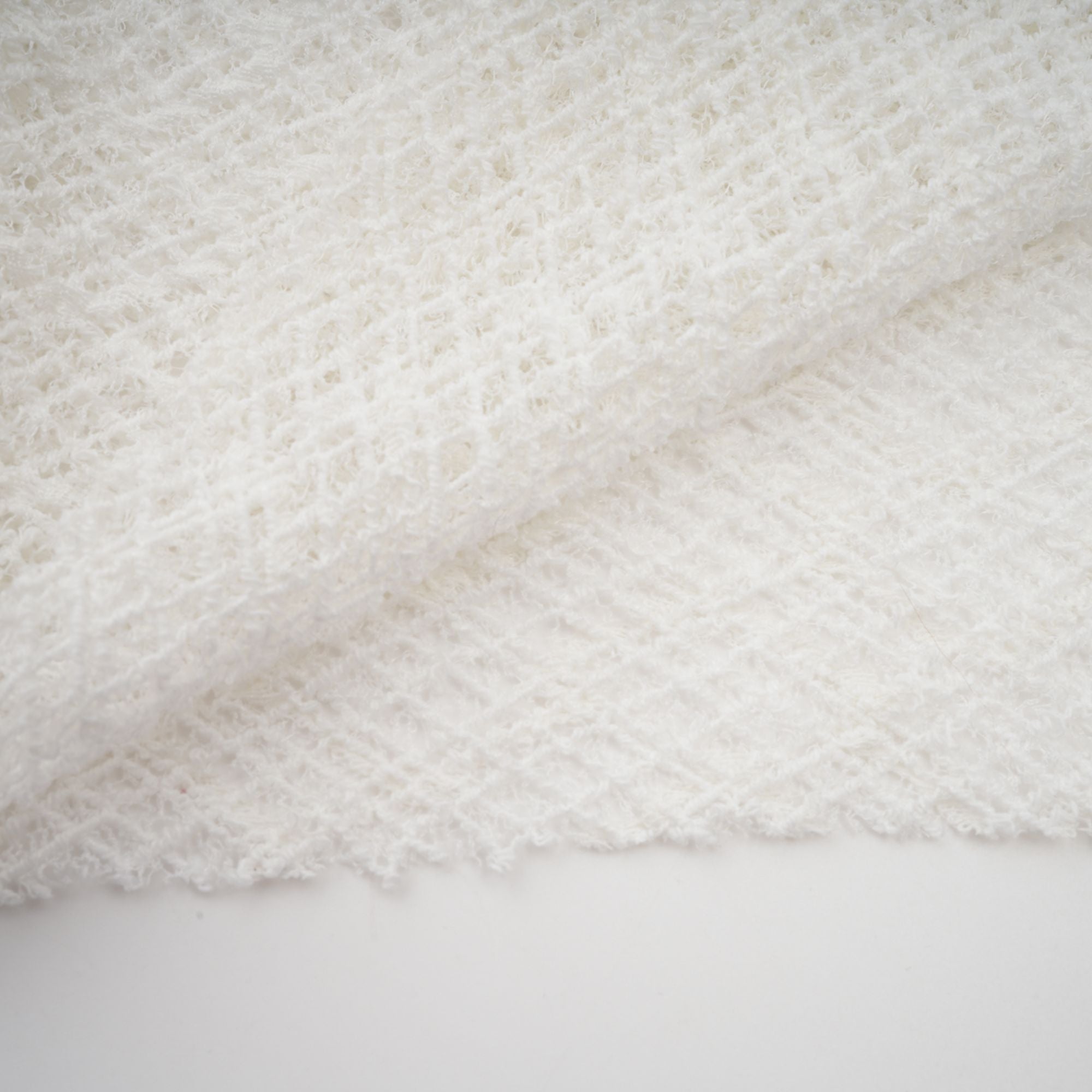 White long-sleeve textured knit gown with a high neck