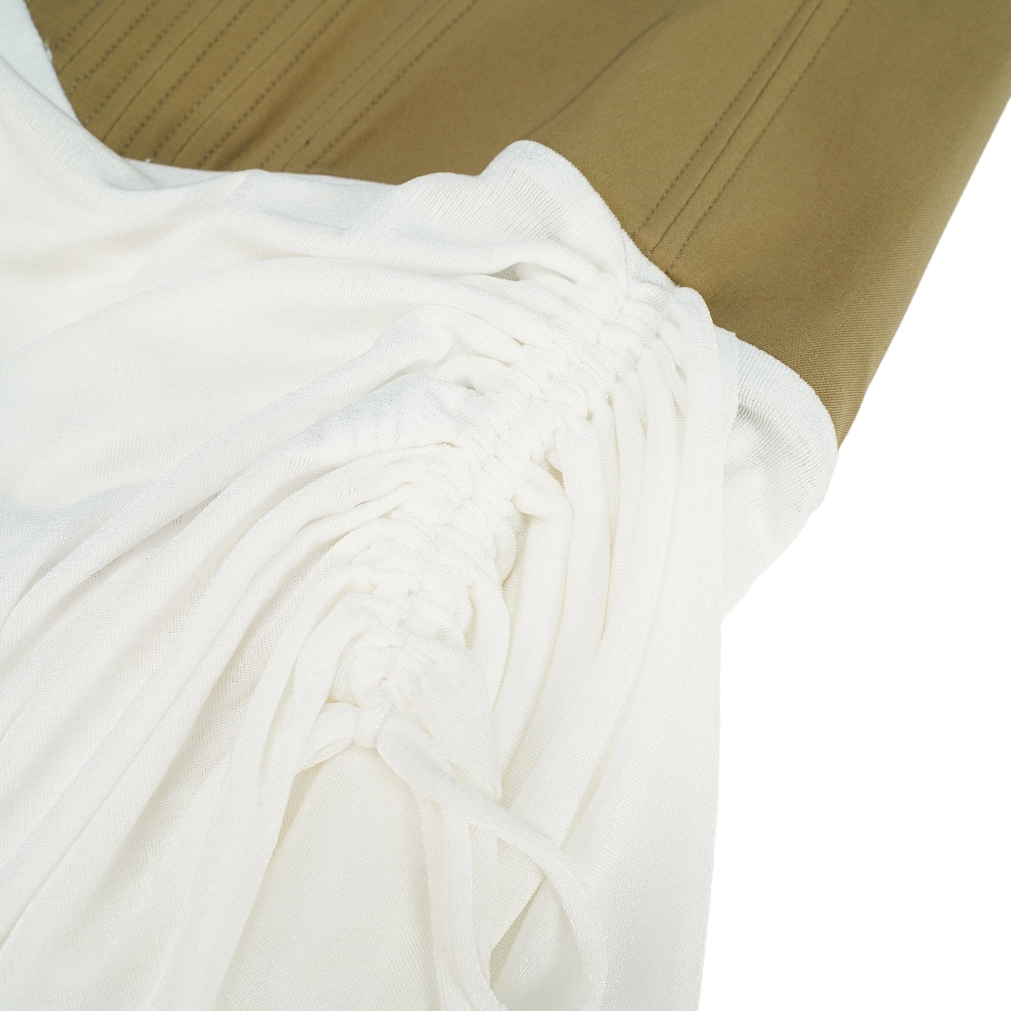 White camisole mini dress featuring a structured tan corset bodice and a draped ruched skirt with drawstring details