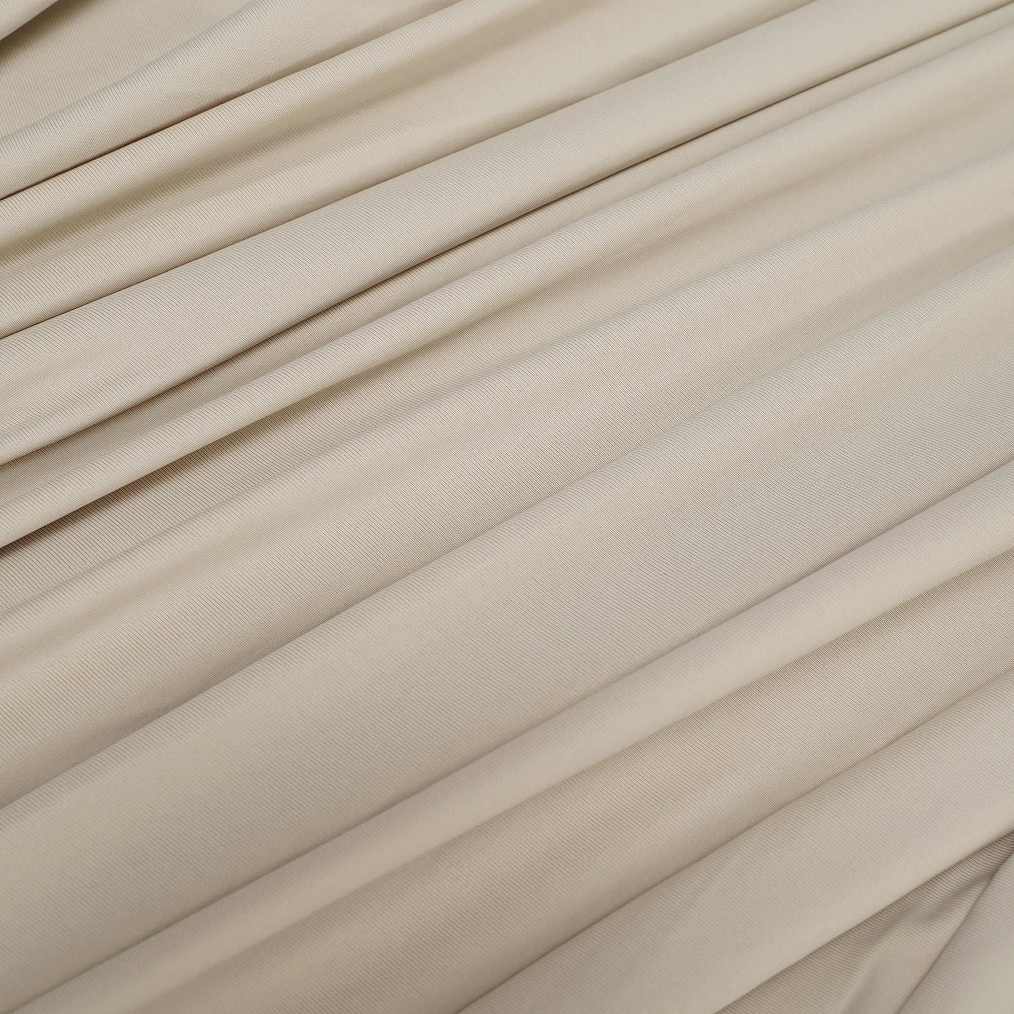 Beige long-sleeve maxi dress with a draped bodice and floor-length cape panel