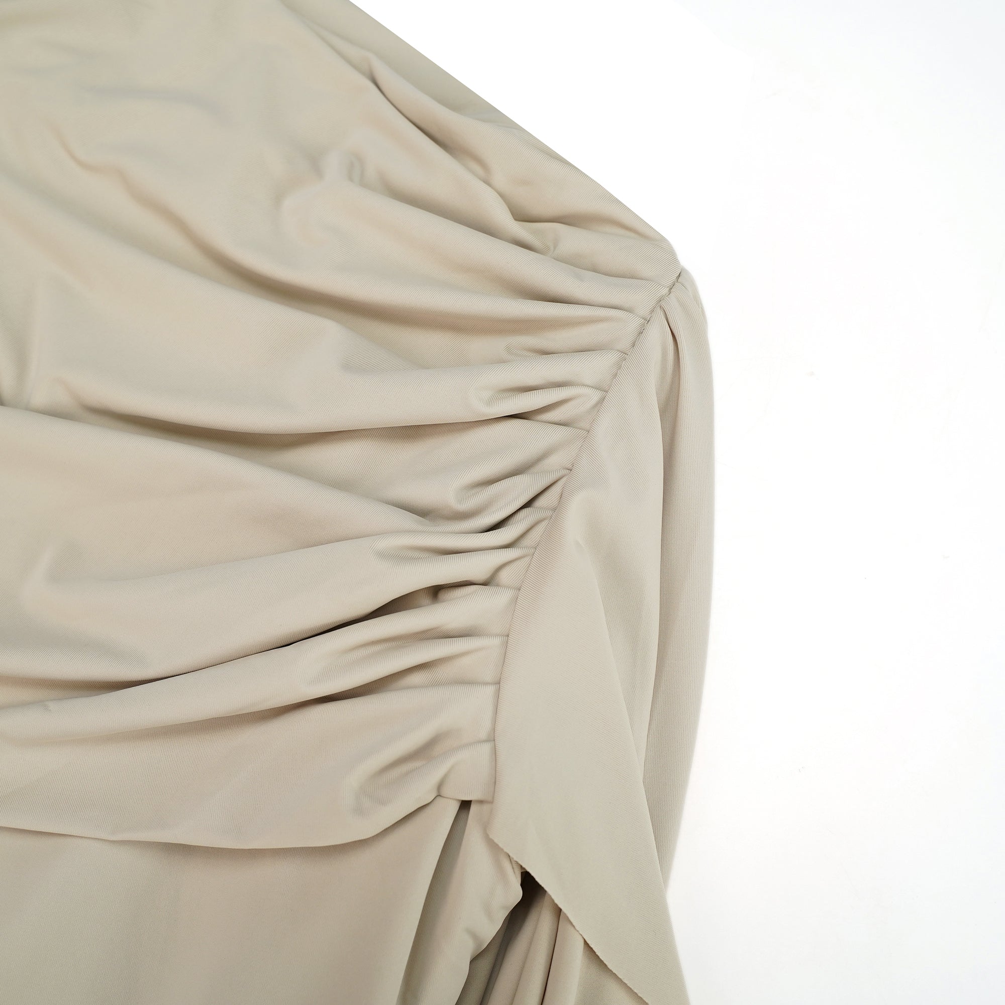 Beige long-sleeve maxi dress with a draped bodice and floor-length cape panel