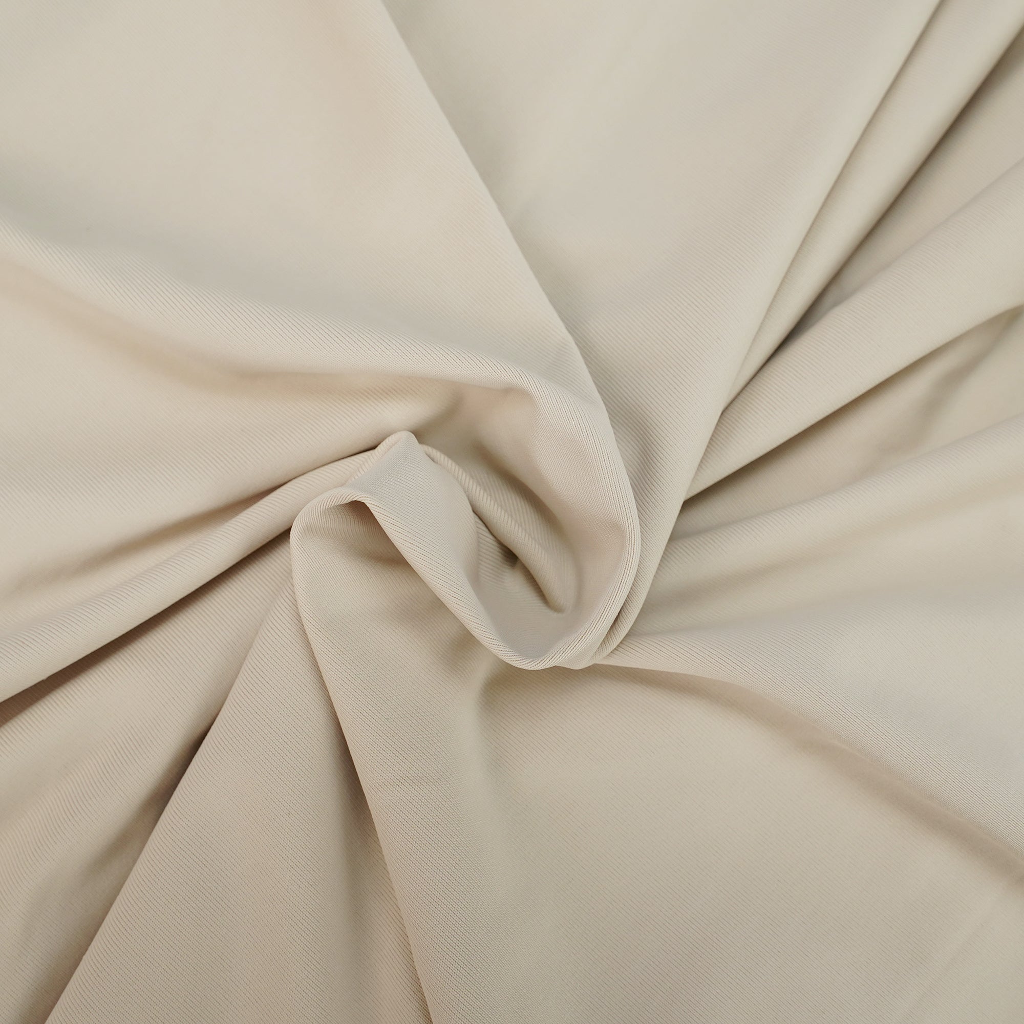 Beige long-sleeve maxi dress with a draped bodice and floor-length cape panel