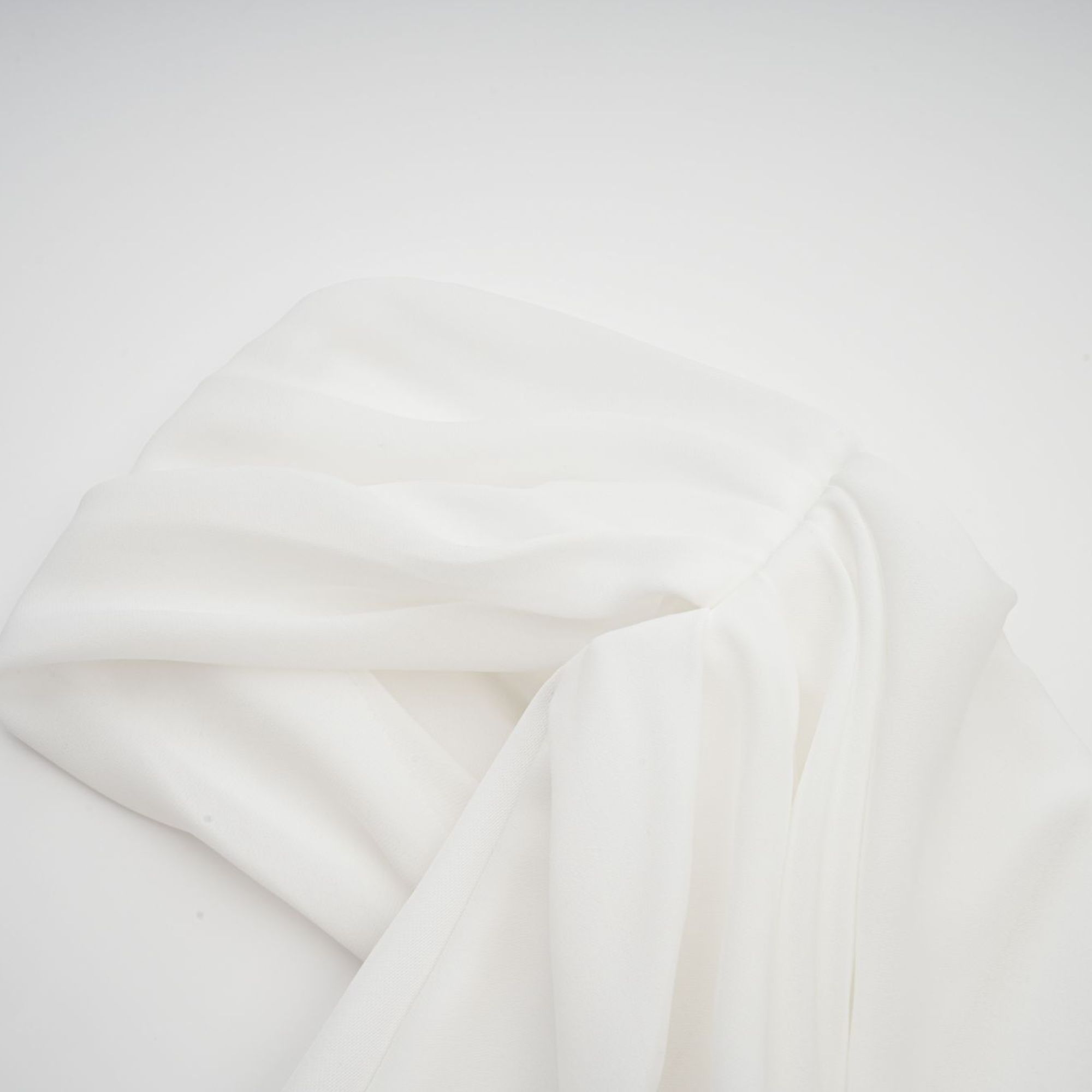 White off-the-shoulder draped mini dress with side panels