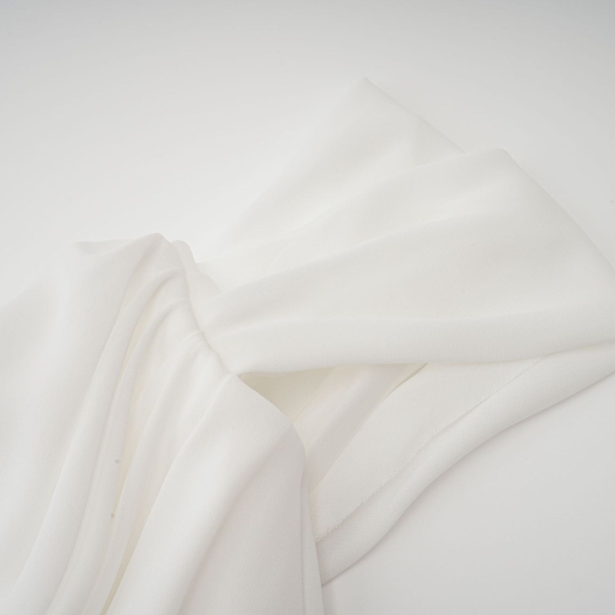 White off-the-shoulder draped mini dress with side panels