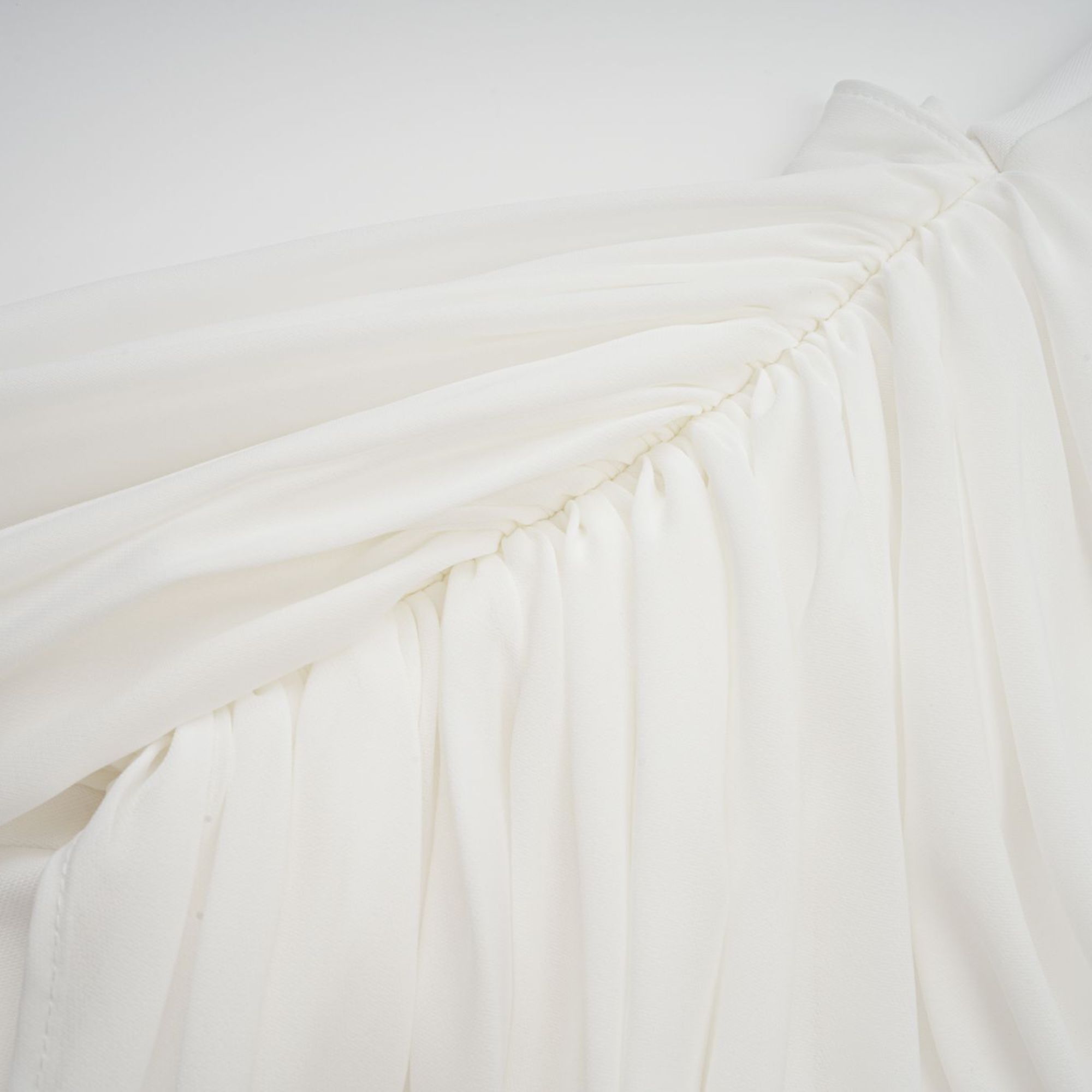 White off-the-shoulder draped mini dress with side panels