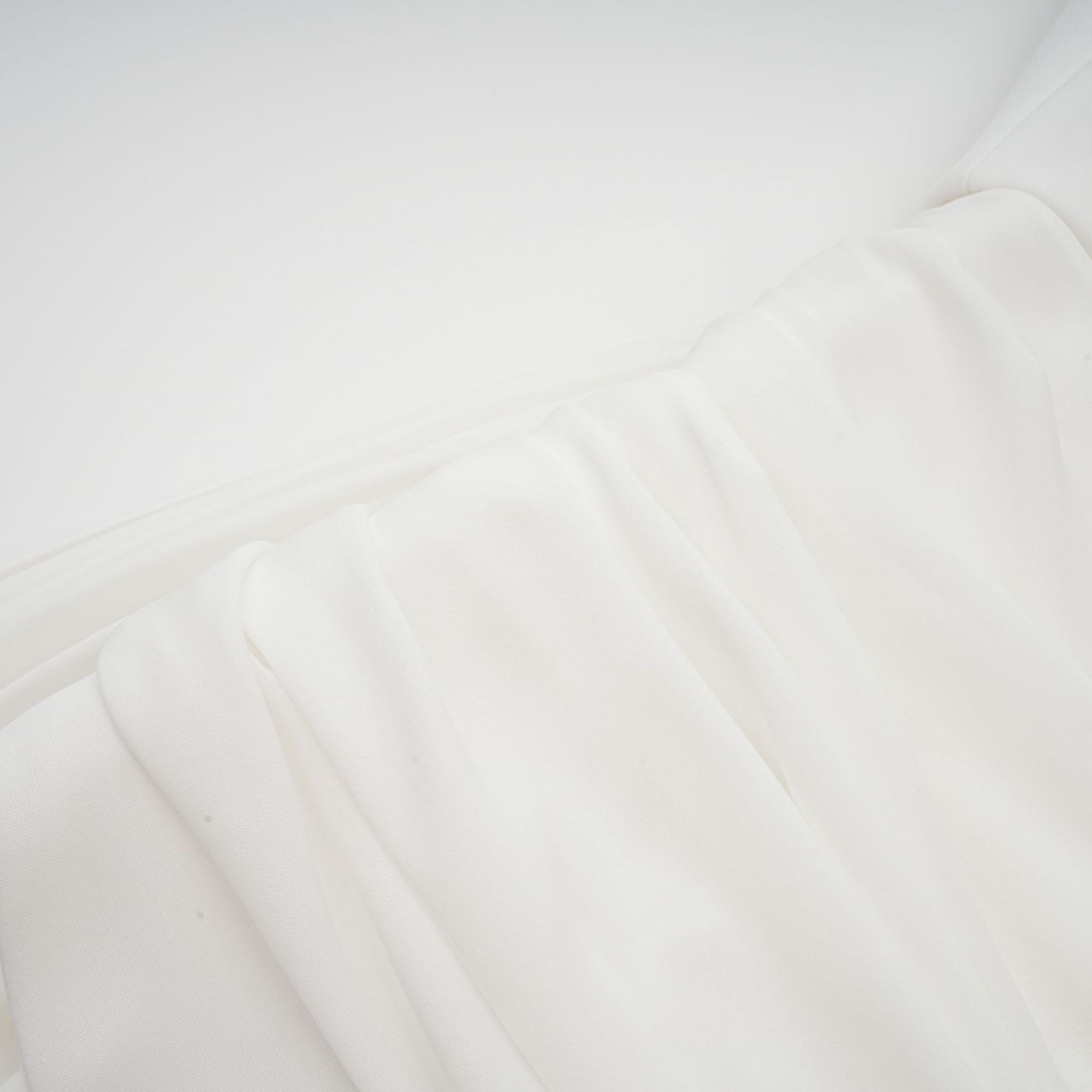 White off-the-shoulder draped mini dress with side panels