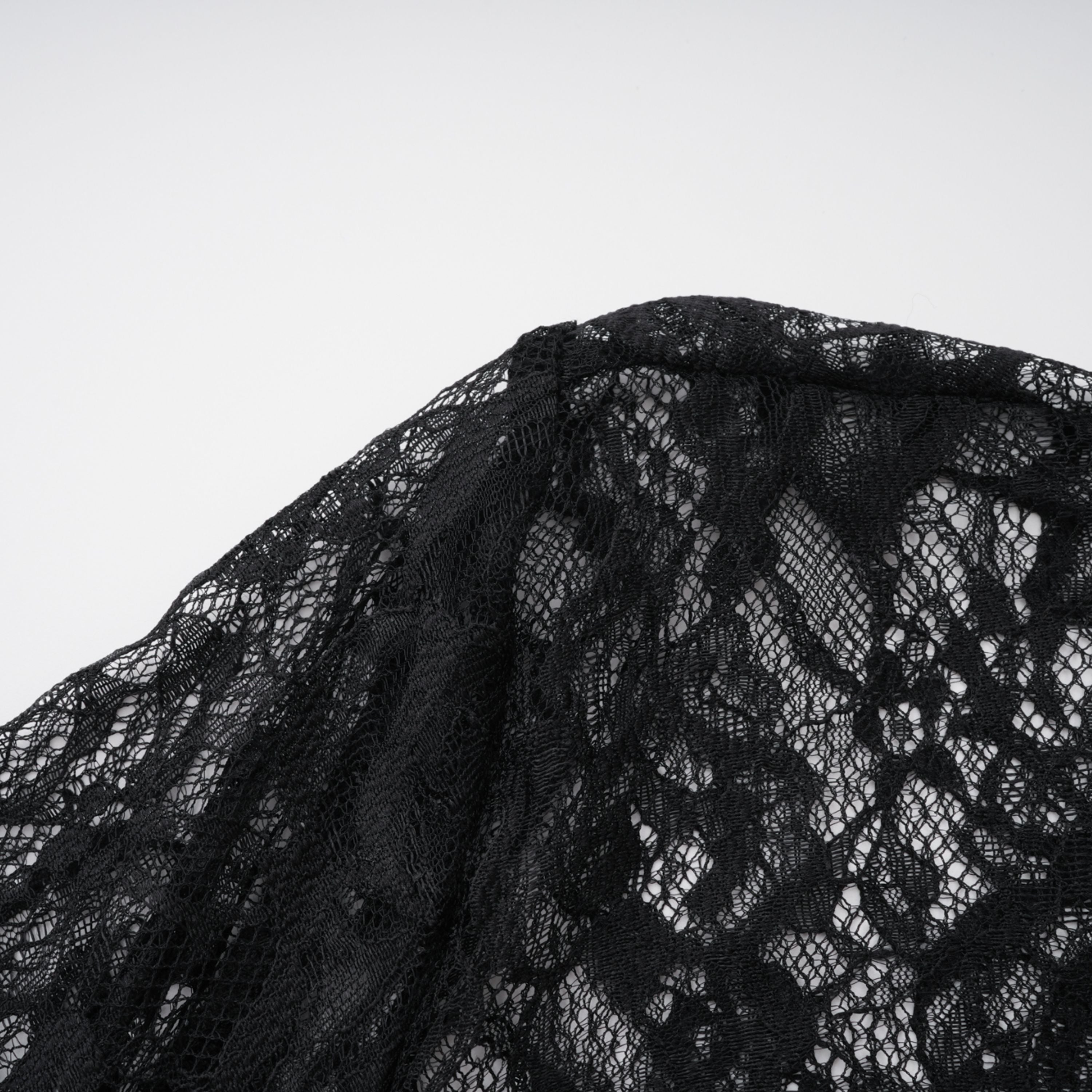 Black sweetheart maxi dress with a sheer lace high-neck overlay and long sleeves