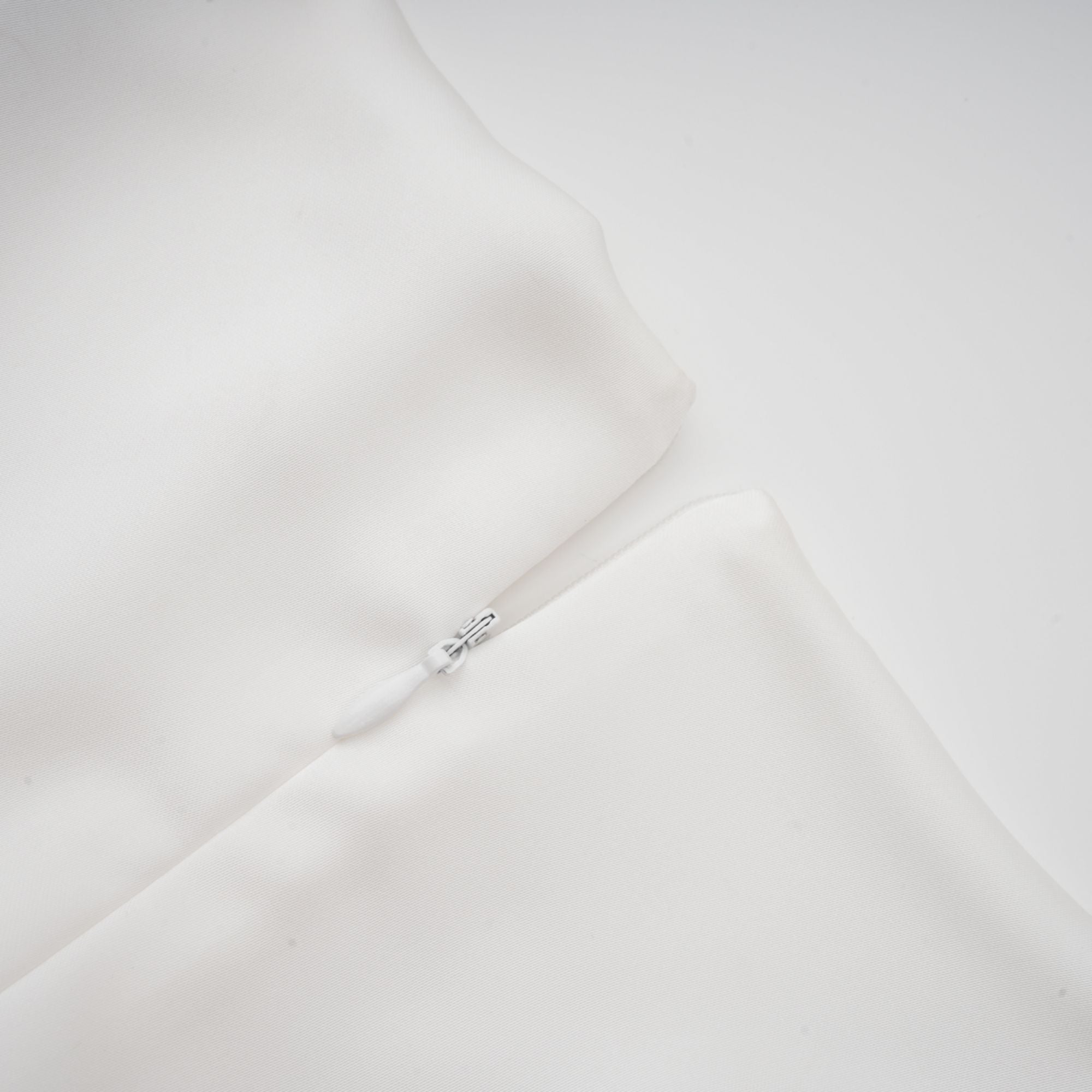 White satin V-neck midi dress with black bow shoulder straps