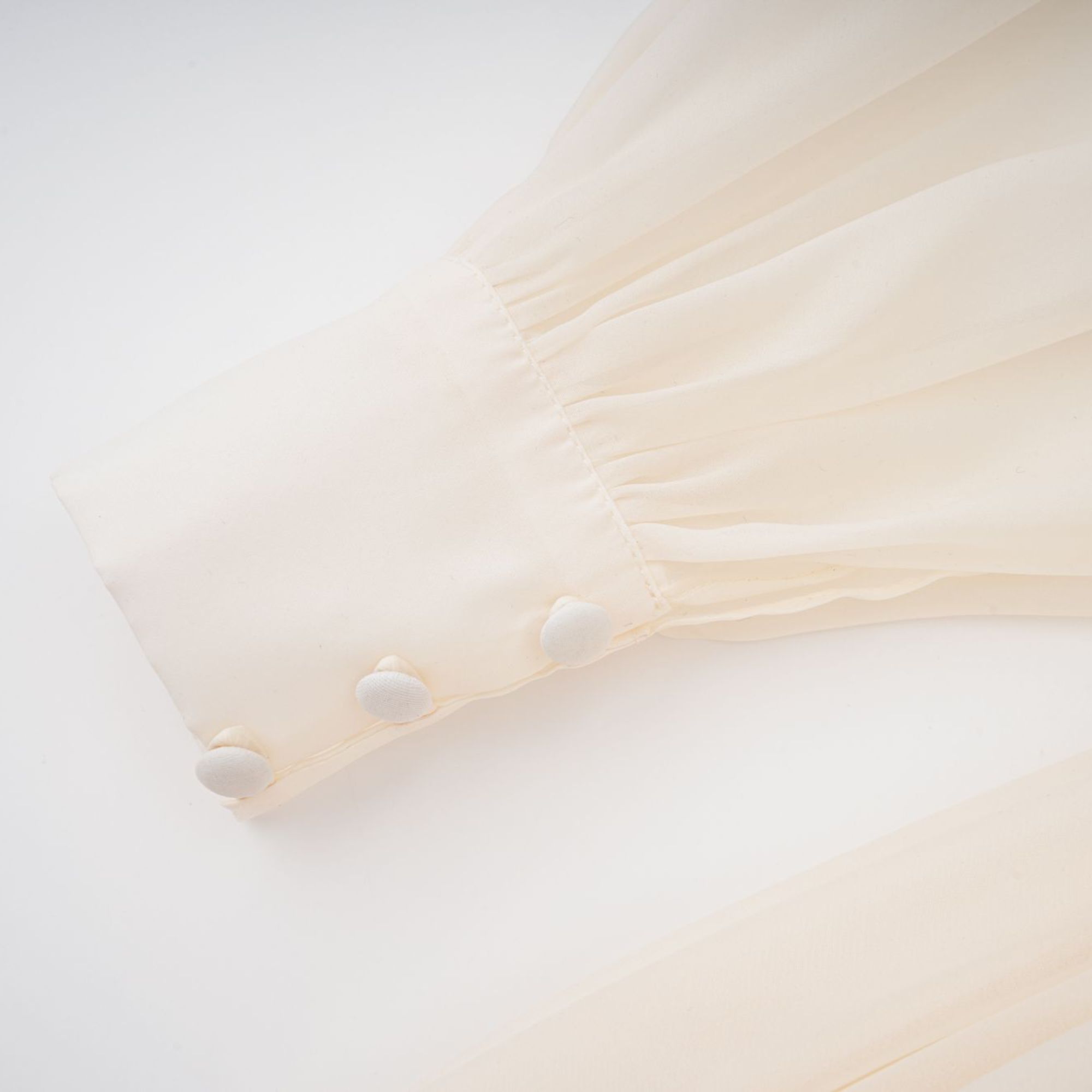 Cream long-sleeve midi dress with a balloon hem