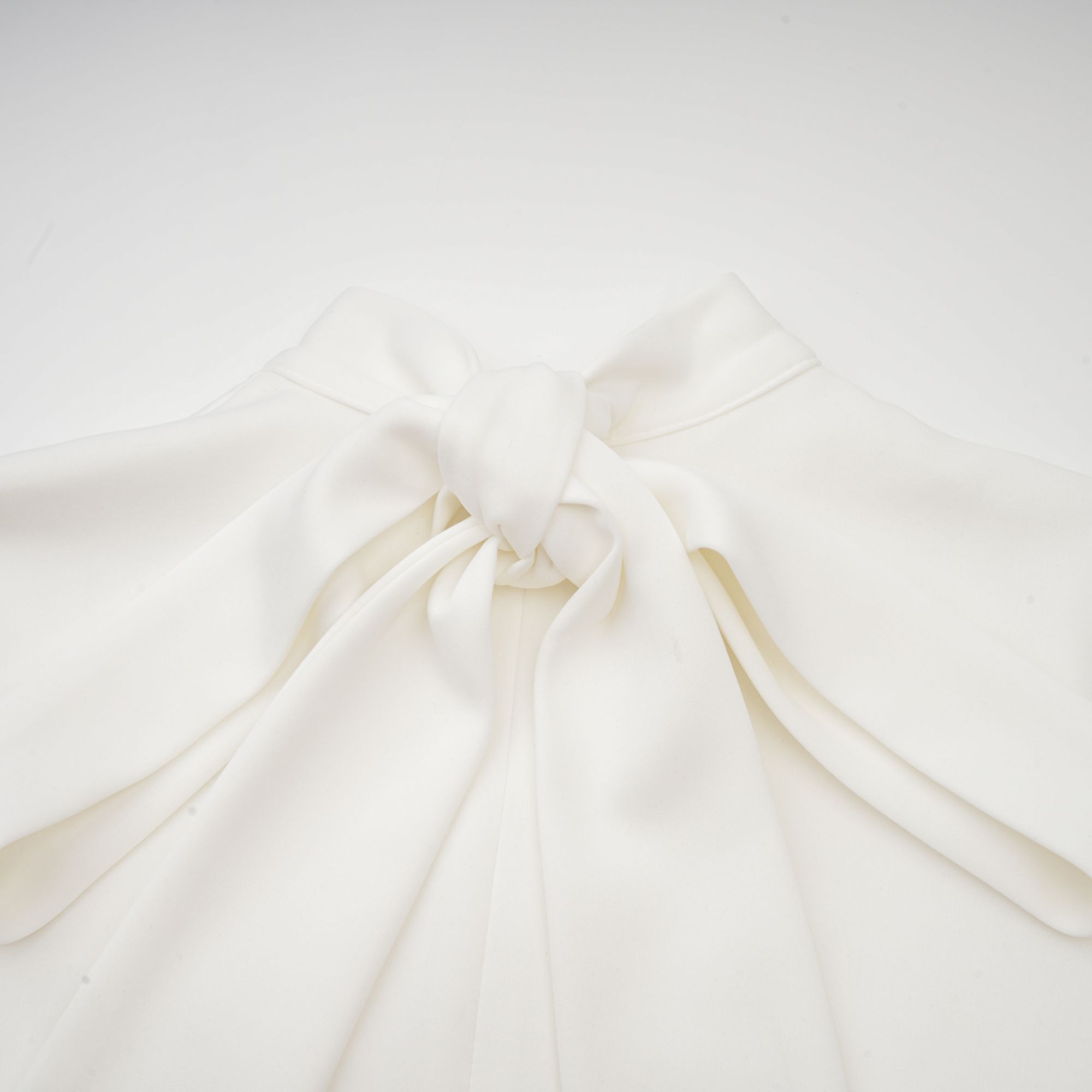 White sleeveless high-neck midi dress with 3D floral embellishments