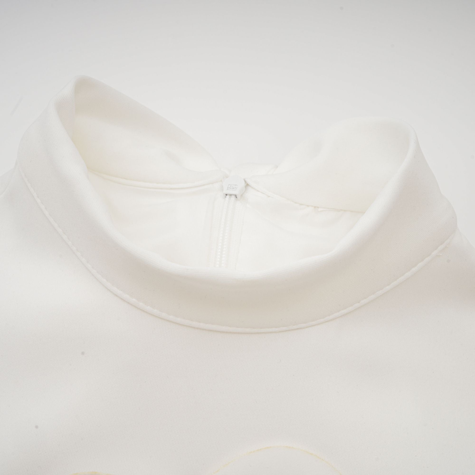 White sleeveless high-neck midi dress with 3D floral embellishments
