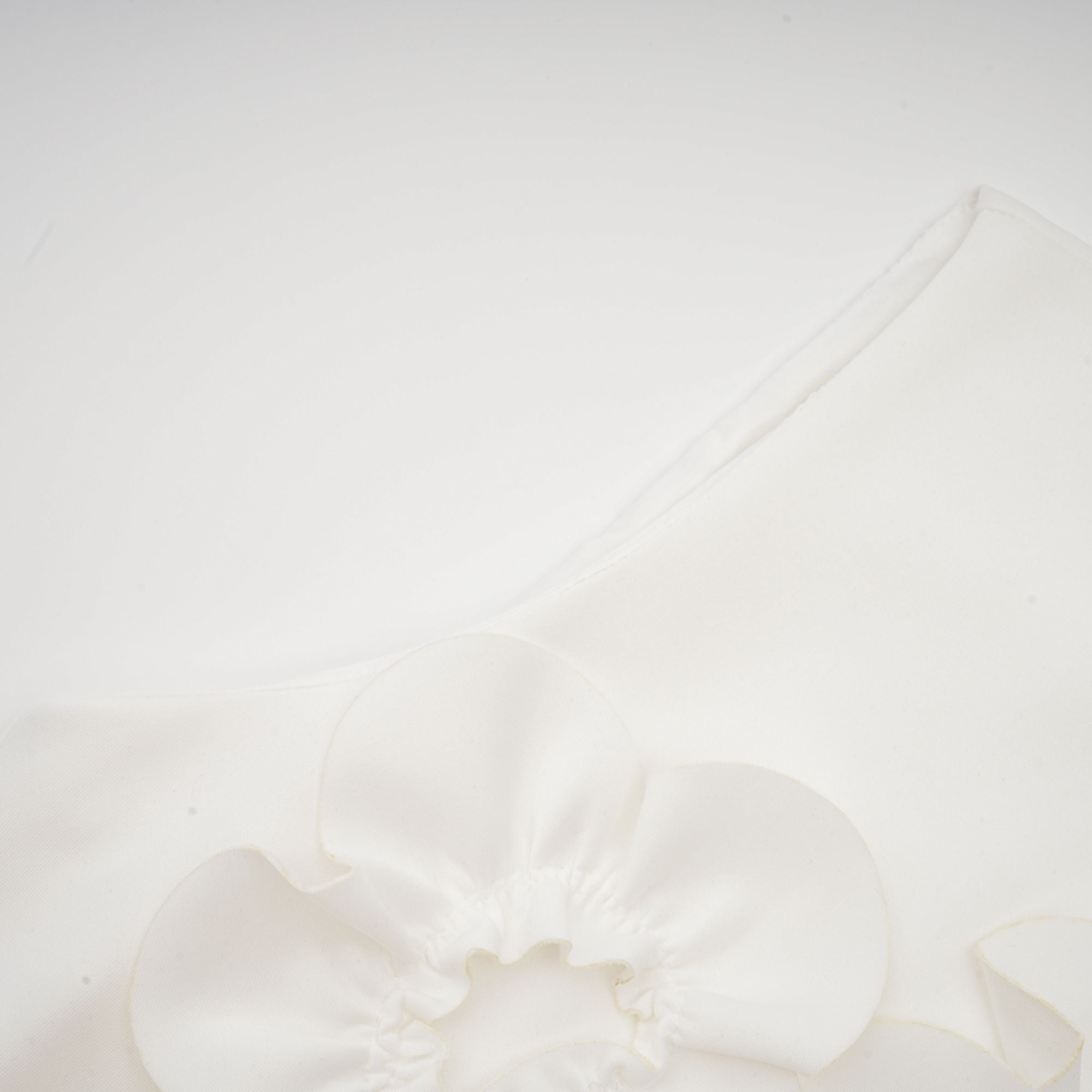 White sleeveless high-neck midi dress with 3D floral embellishments