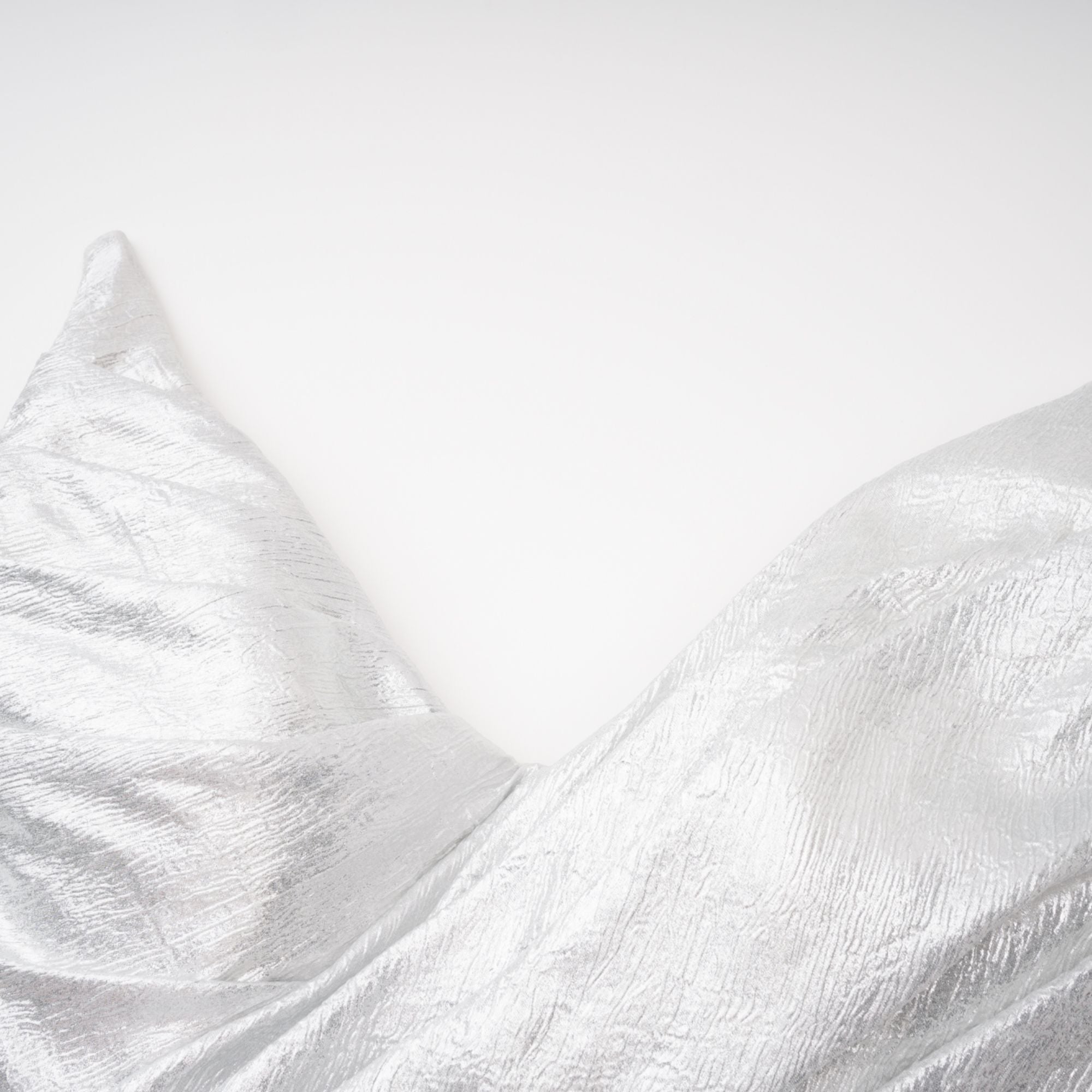 Metallic silver strapless gown with high slit