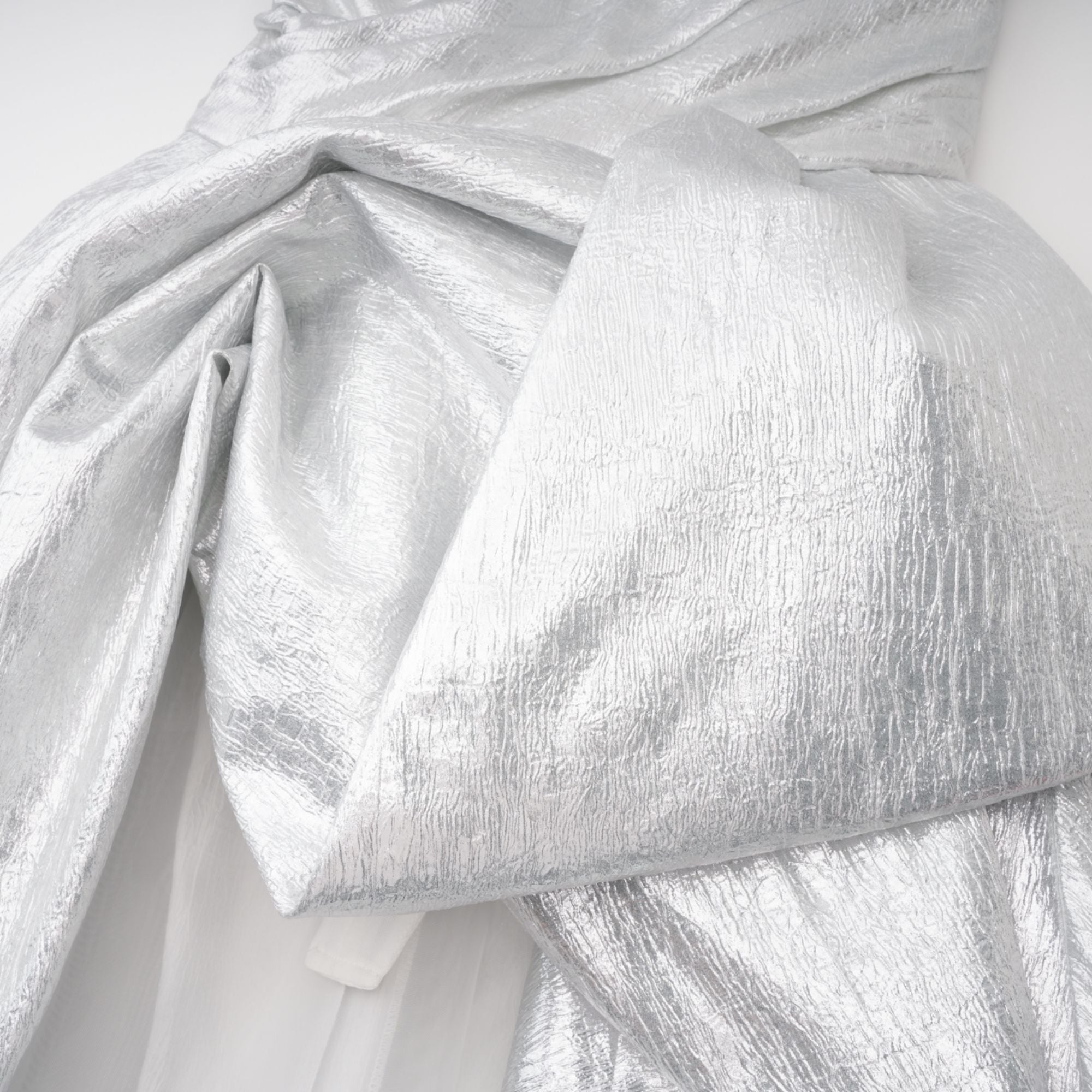 Metallic silver strapless gown with high slit