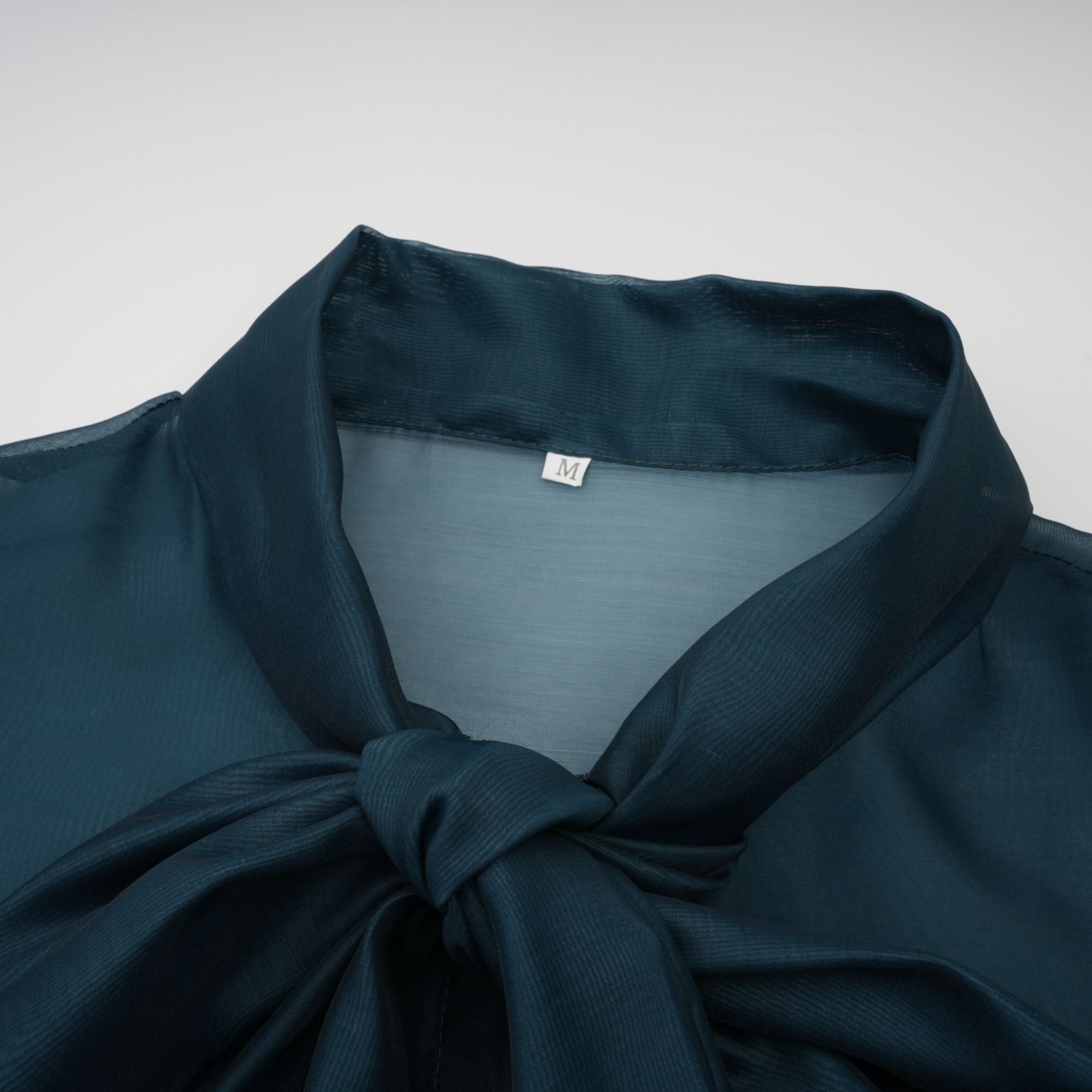 Black long-sleeve maxi dress with a pussy-bow neckline