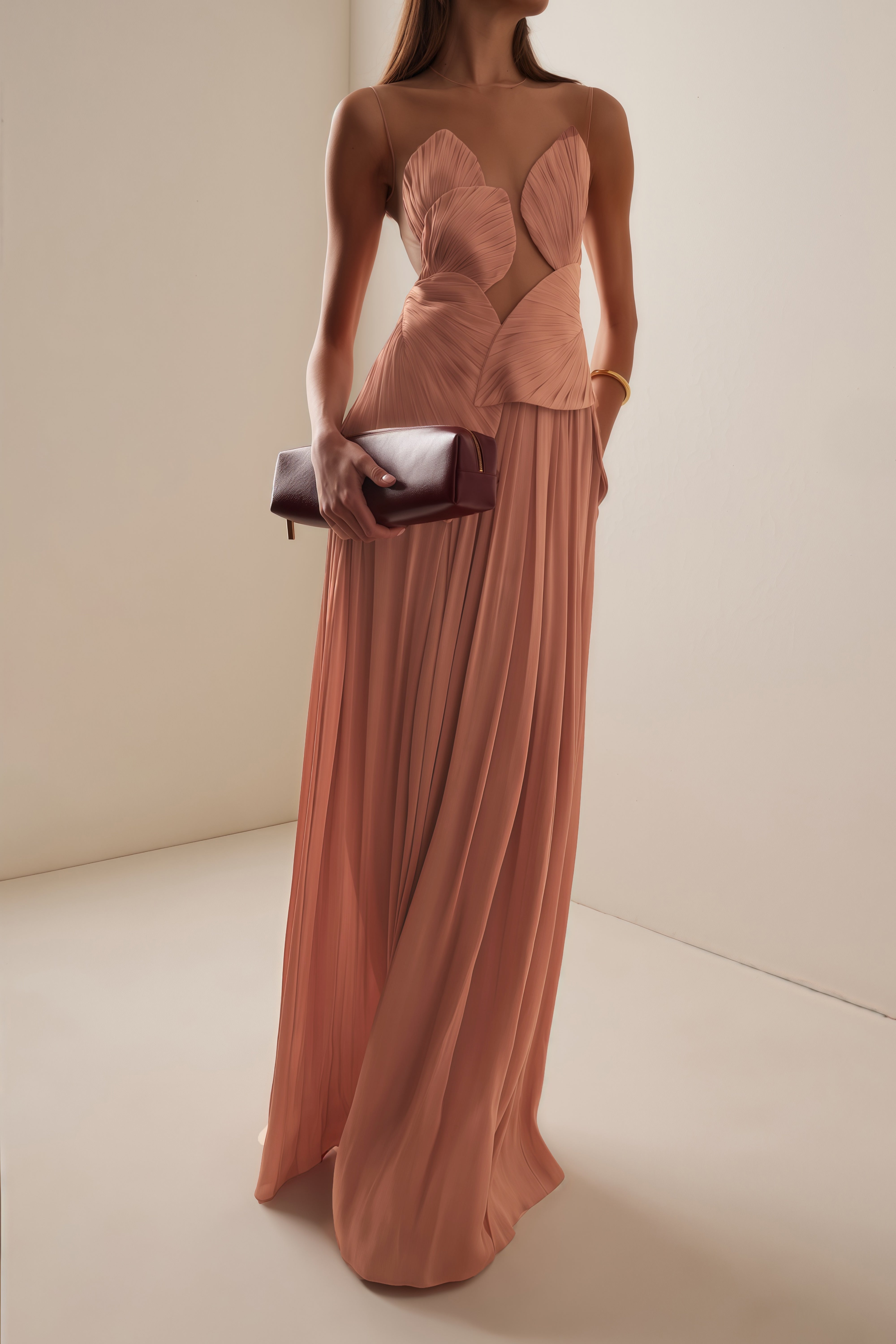 Dusty rose pleated maxi dress featuring a structured geometric bodice with a sheer mesh illusion neckline