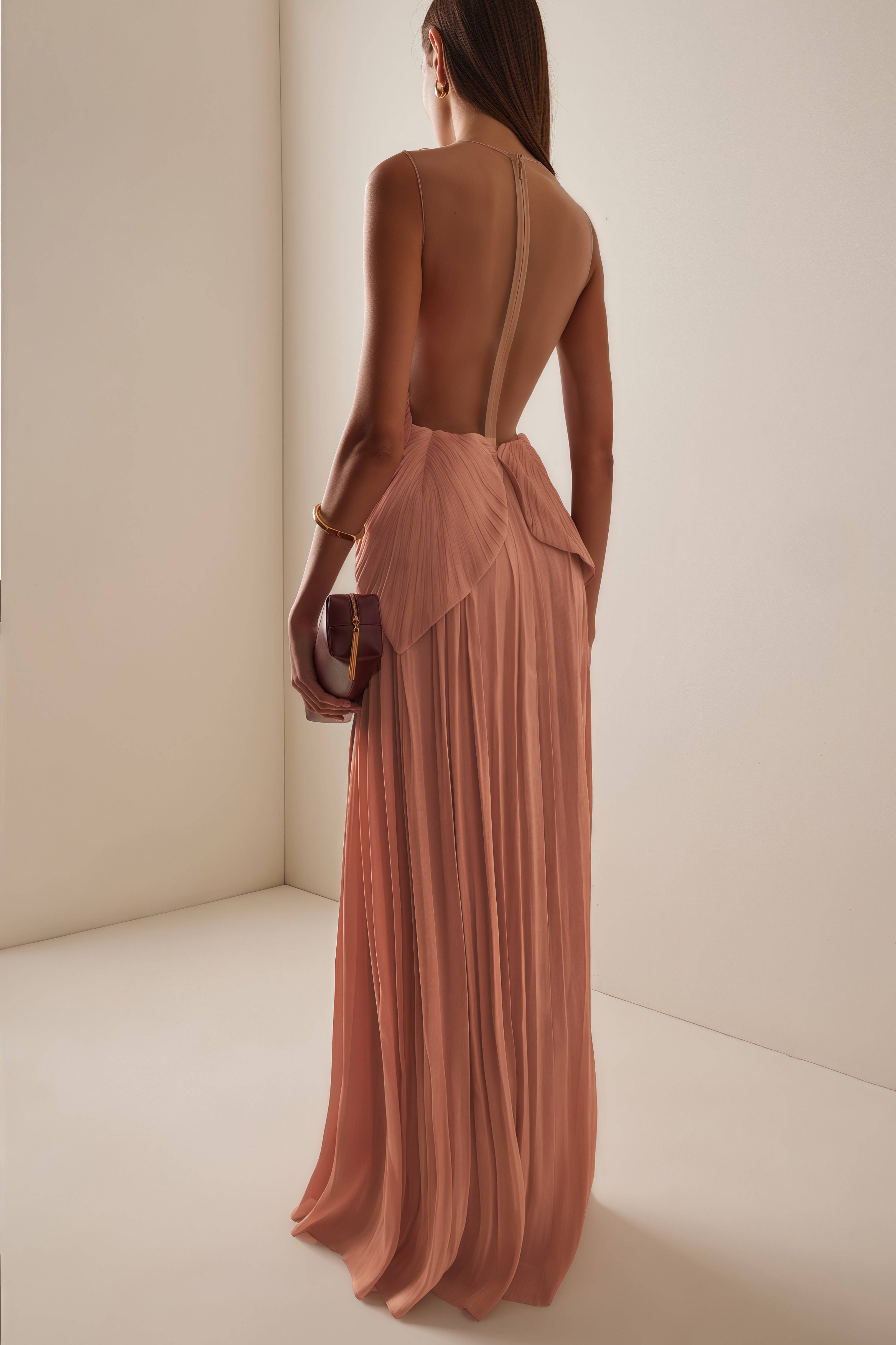Dusty rose pleated maxi dress featuring a structured geometric bodice with a sheer mesh illusion neckline