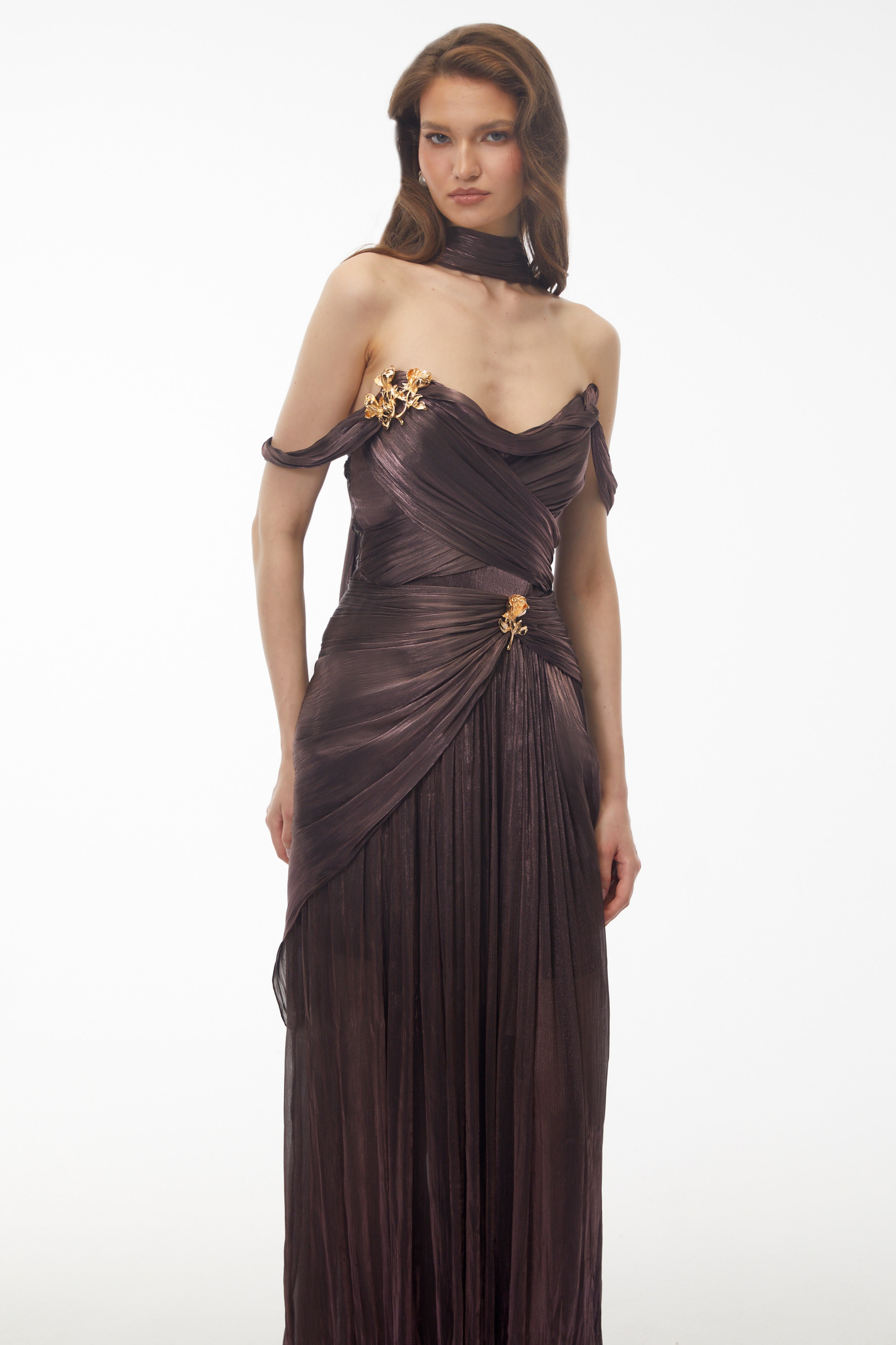 Metallic bronze maxi dress with an off-the-shoulder draped bodice, matching neck scarf, and high leg slit