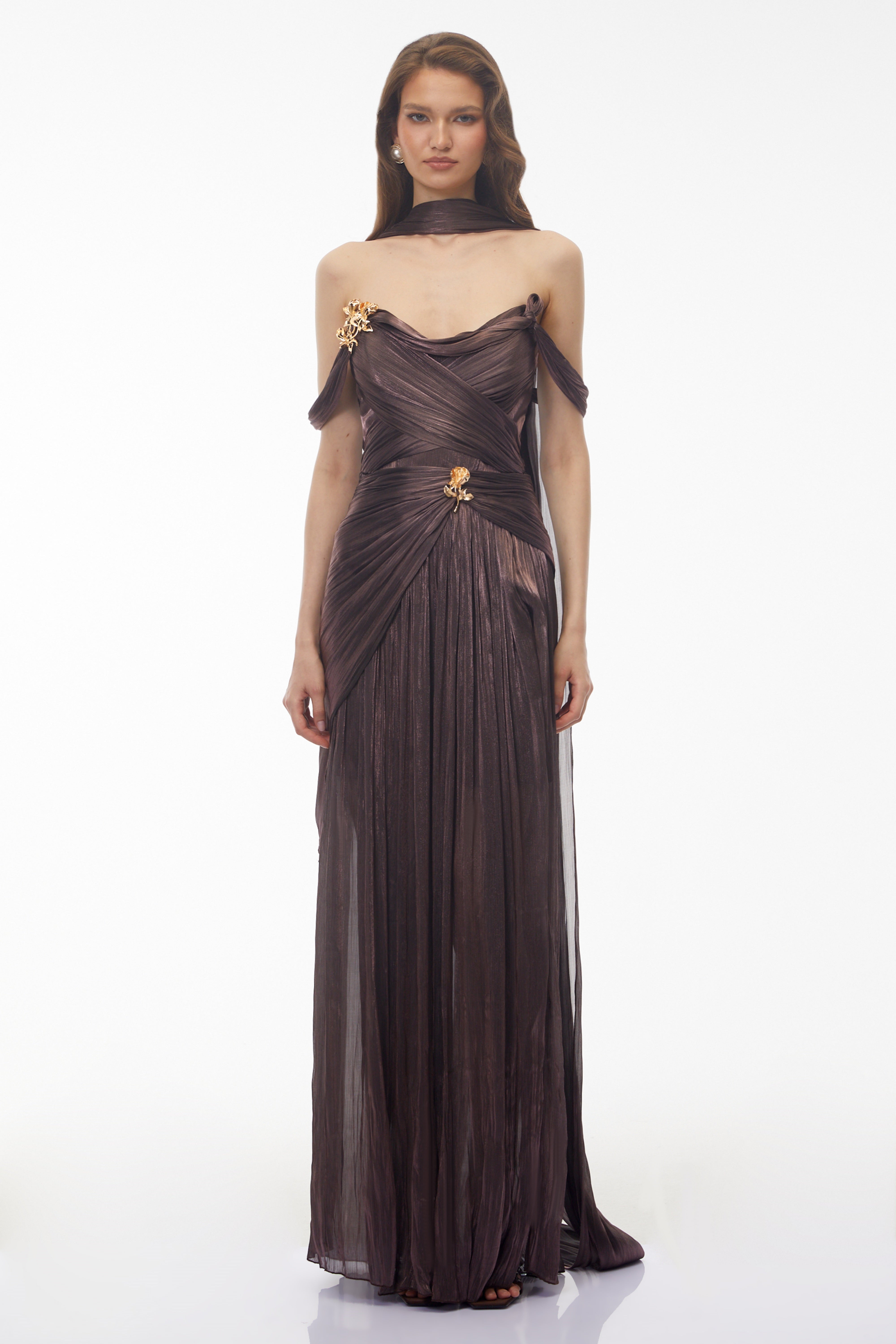 Metallic bronze maxi dress with an off-the-shoulder draped bodice, matching neck scarf, and high leg slit