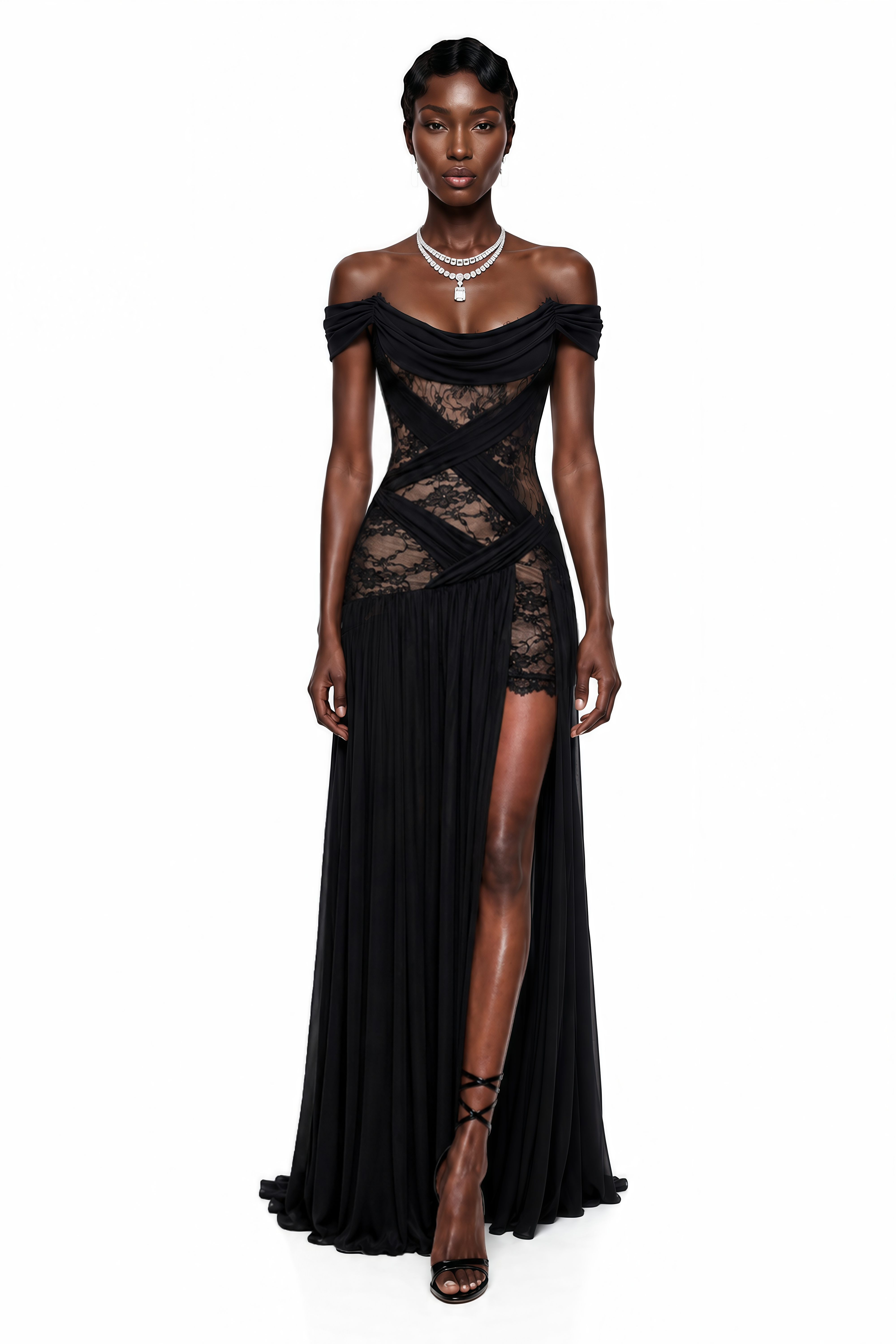 Black off-the-shoulder gown with lace panels and a high slit