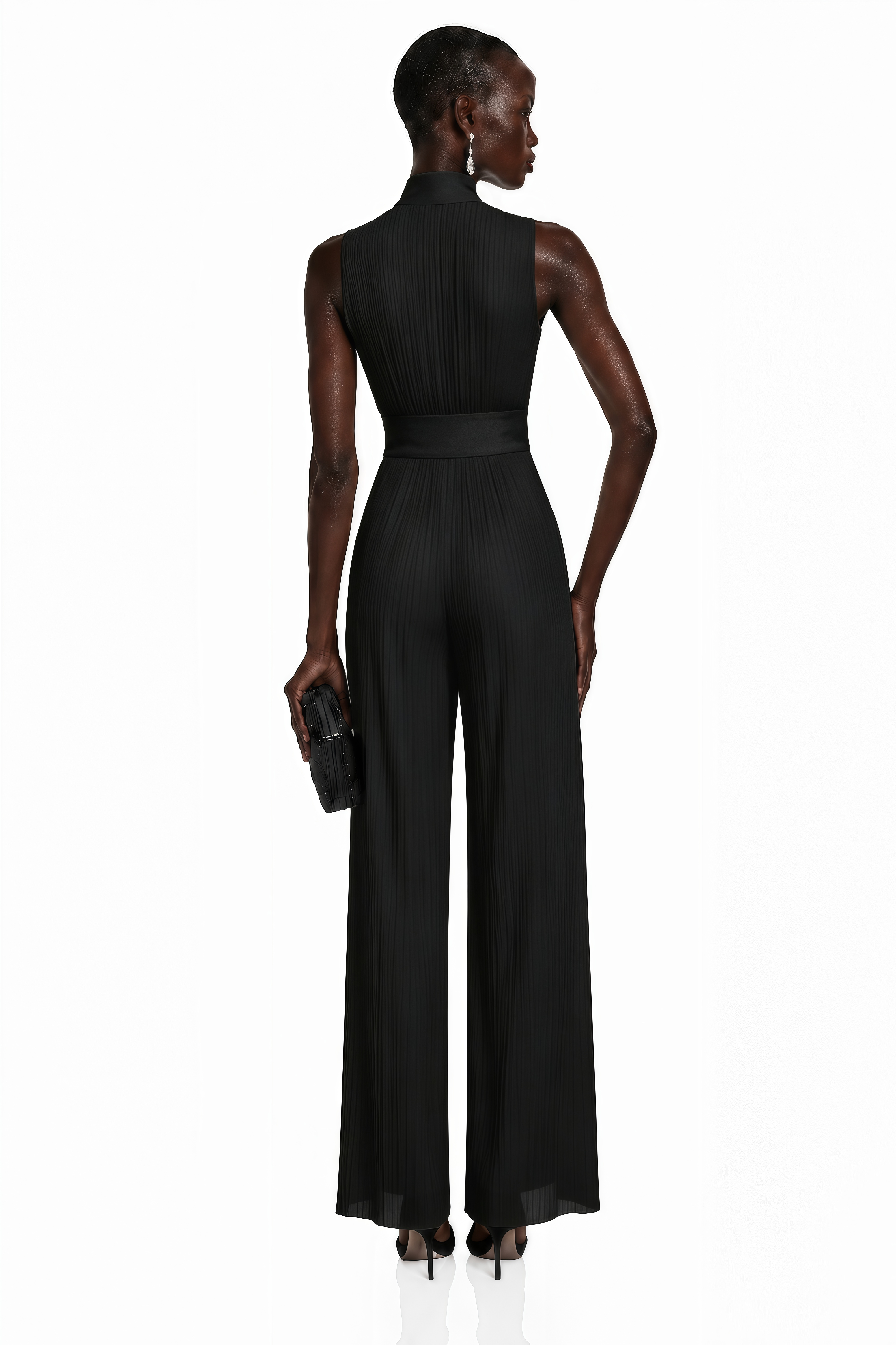 Black pleated wide-leg jumpsuit with a front zipper and wide waistband
