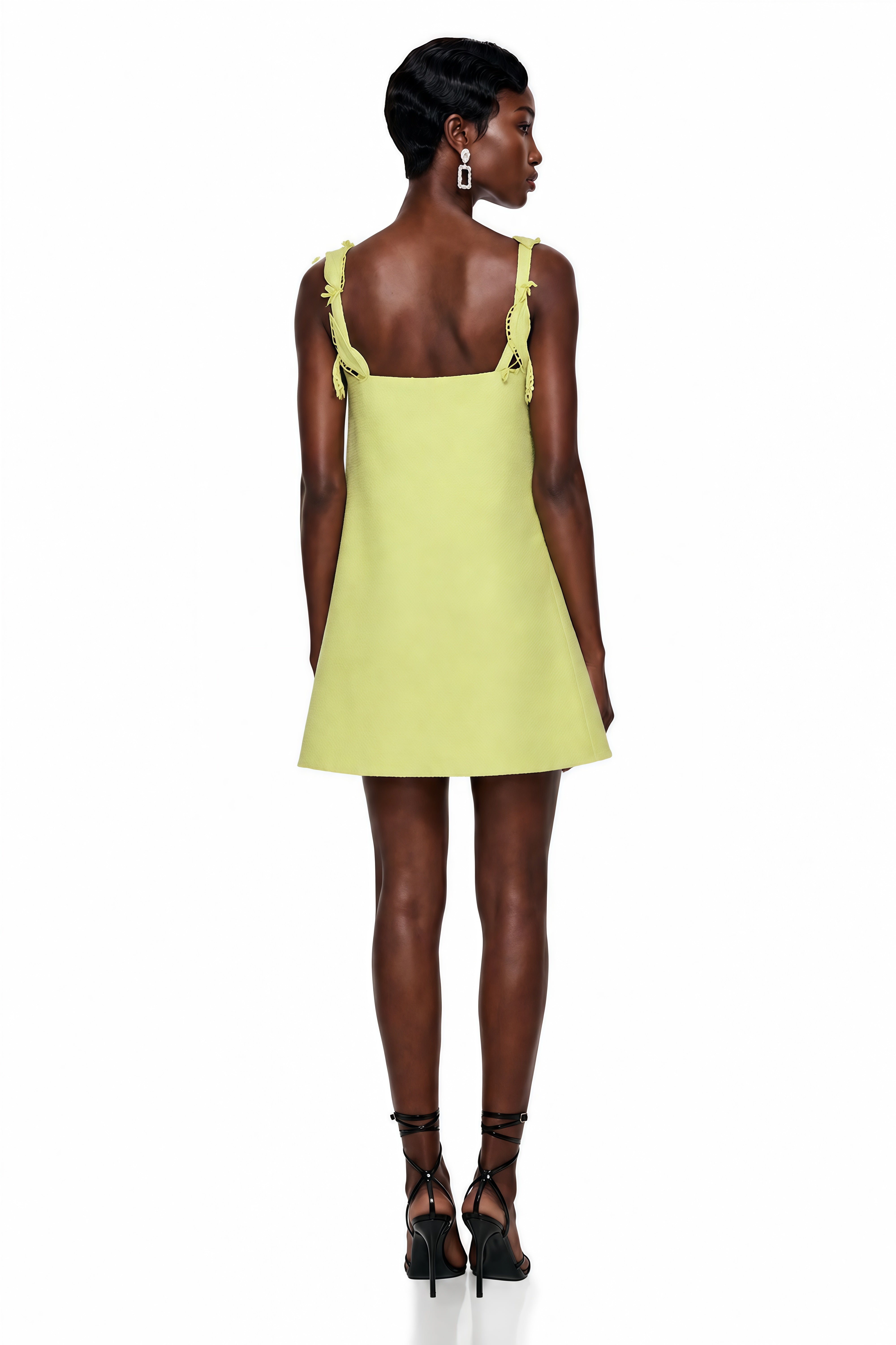 Lime green structured mini dress featuring cutout vine embroidery and 3D floral appliqués with matching lace straps