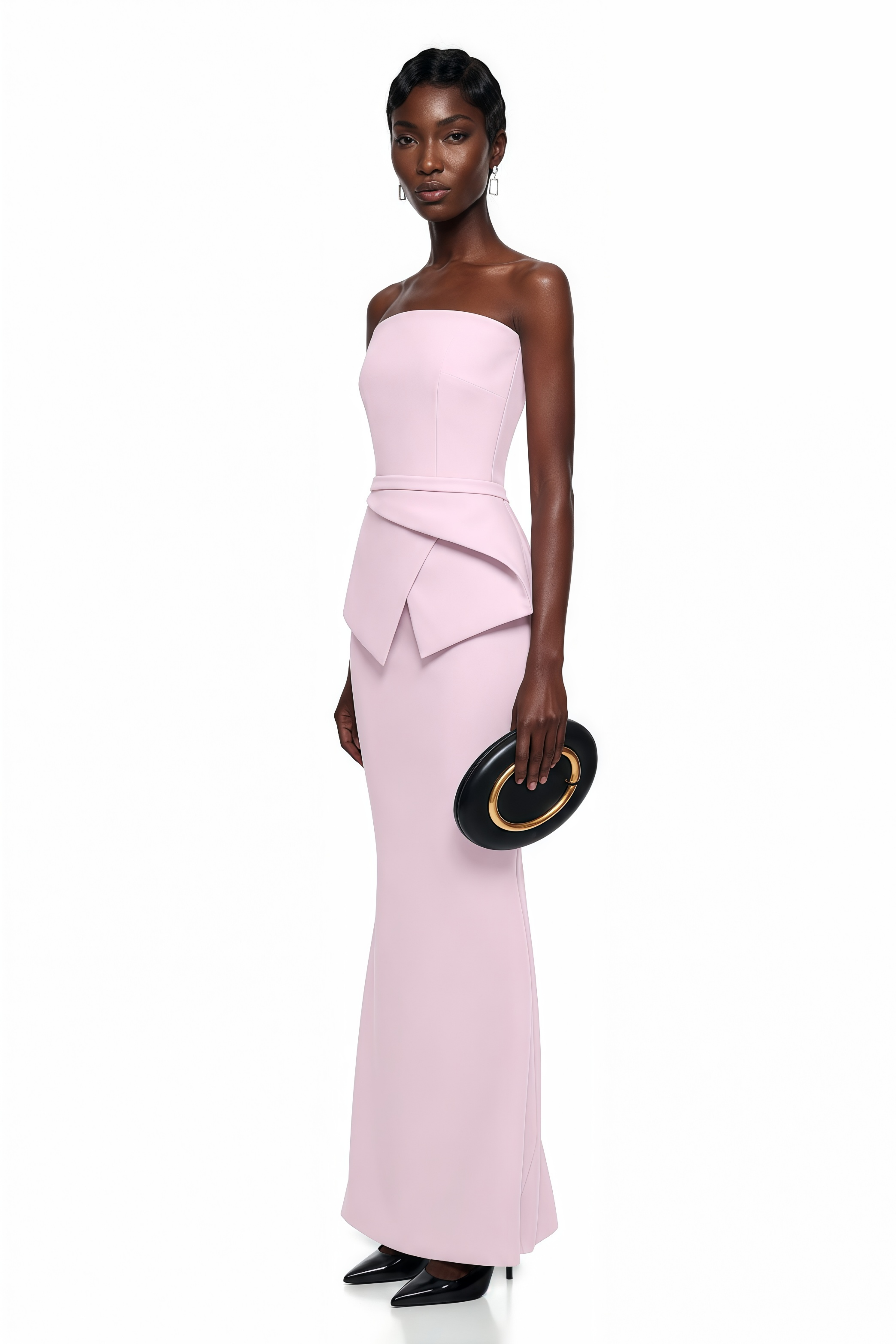 Light pink strapless maxi dress featuring a structured bodice and a geometric asymmetric peplum waist