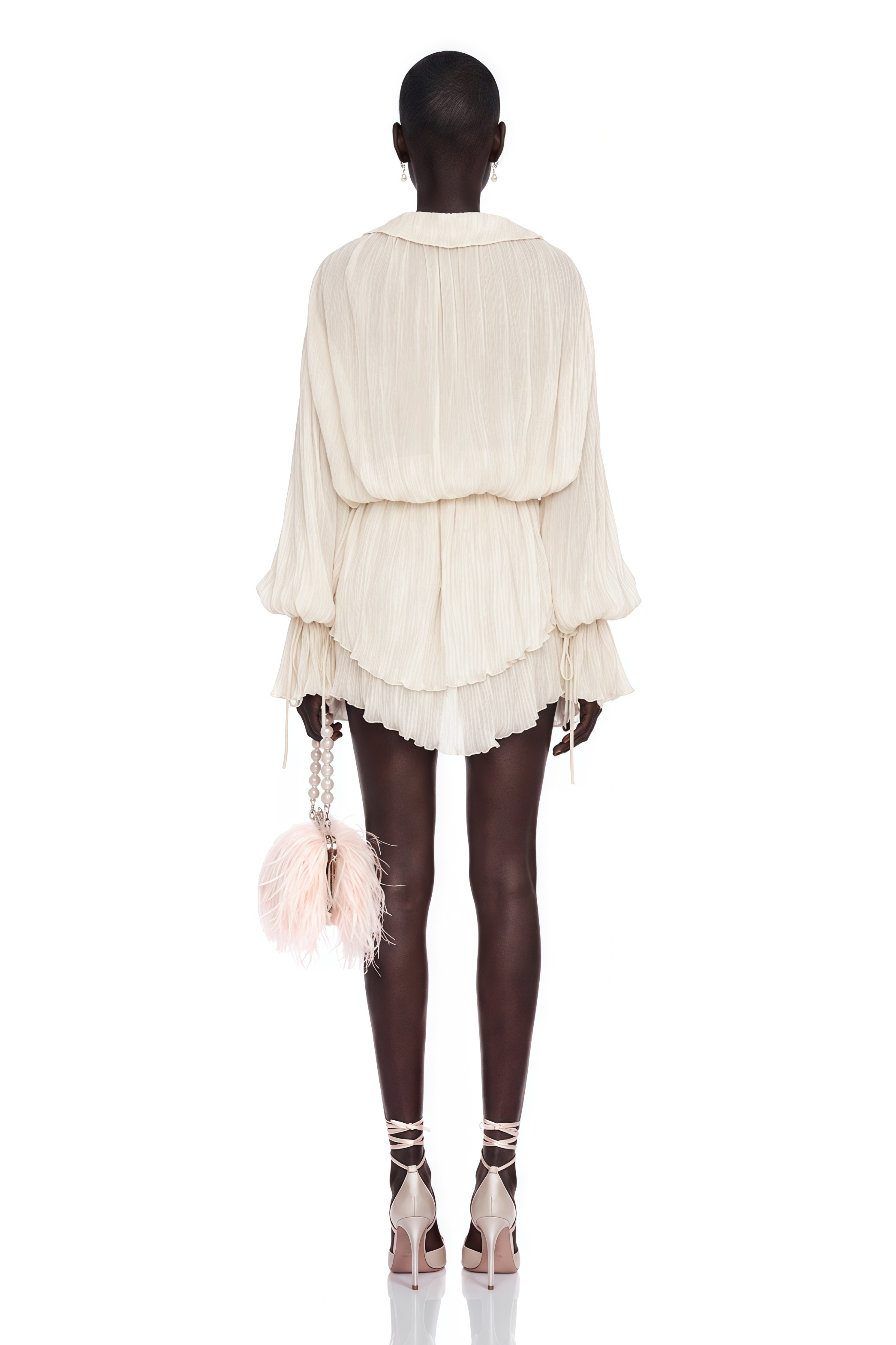 Ivory long-sleeve pleated mini dress with a lace-trimmed deep V-neckline