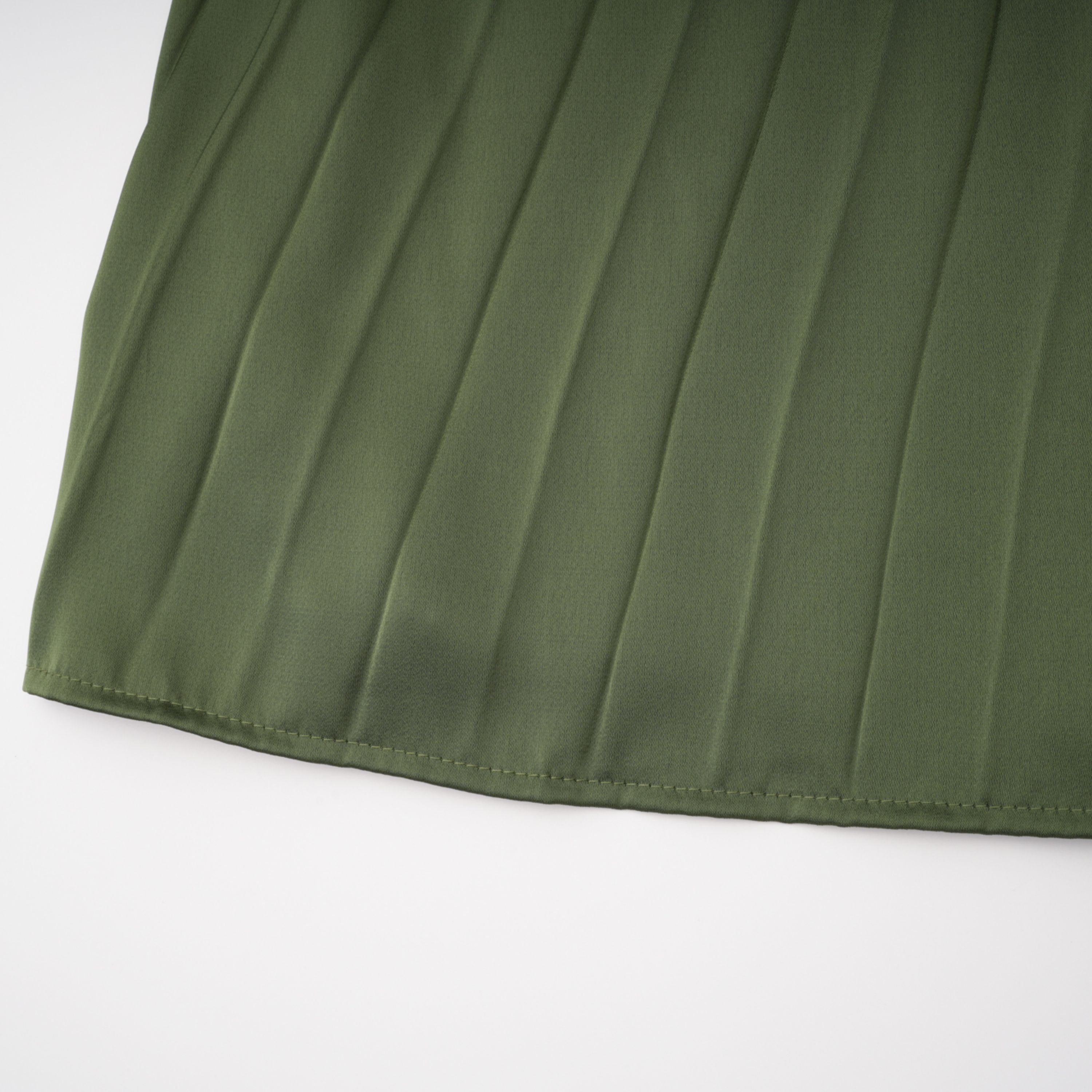Olive green maxi dress with a pleated one-shoulder neckline and fully pleated draped skirt