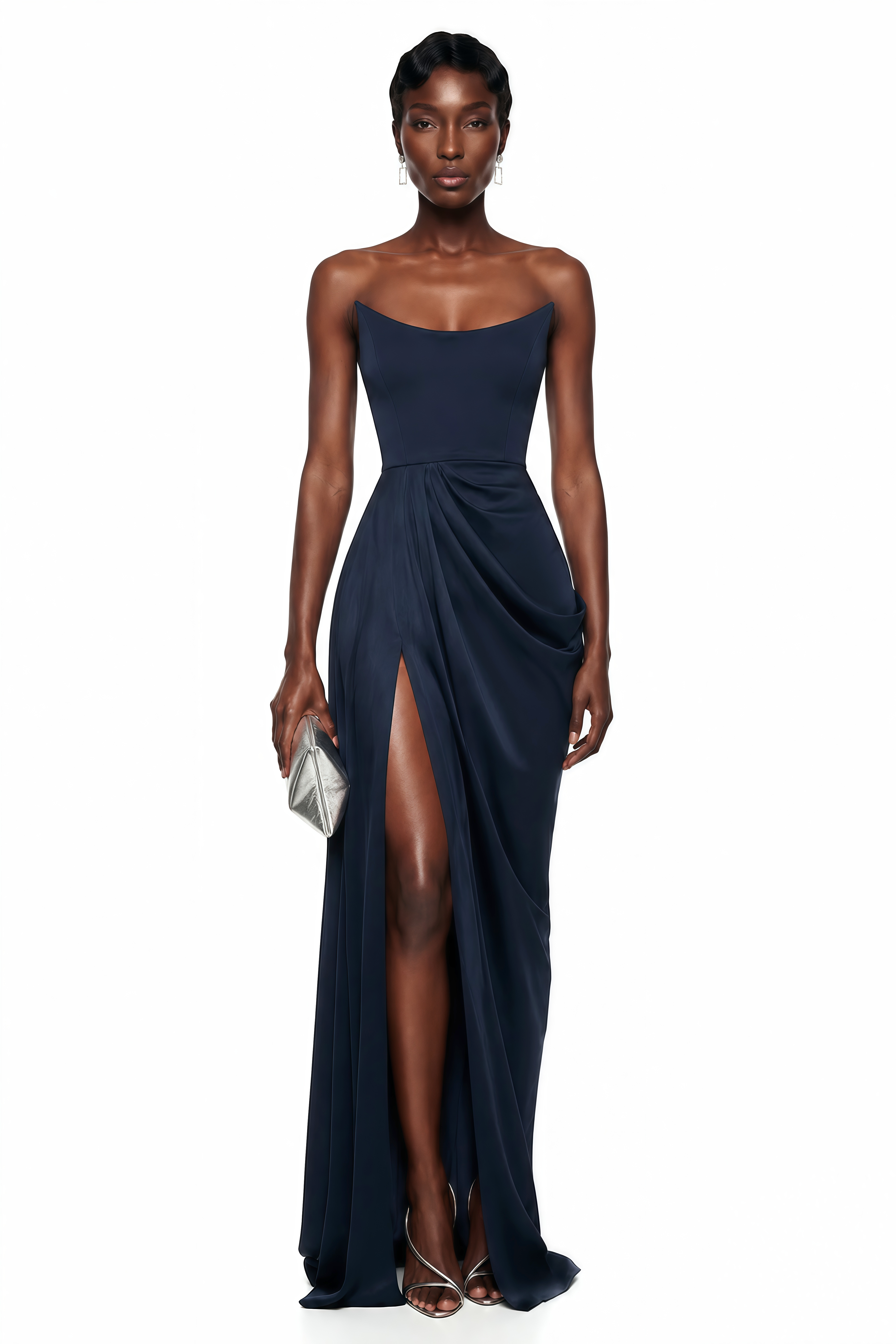 Navy blue strapless maxi dress with a fitted curved bodice, draped wrap skirt, and high thigh-high slit