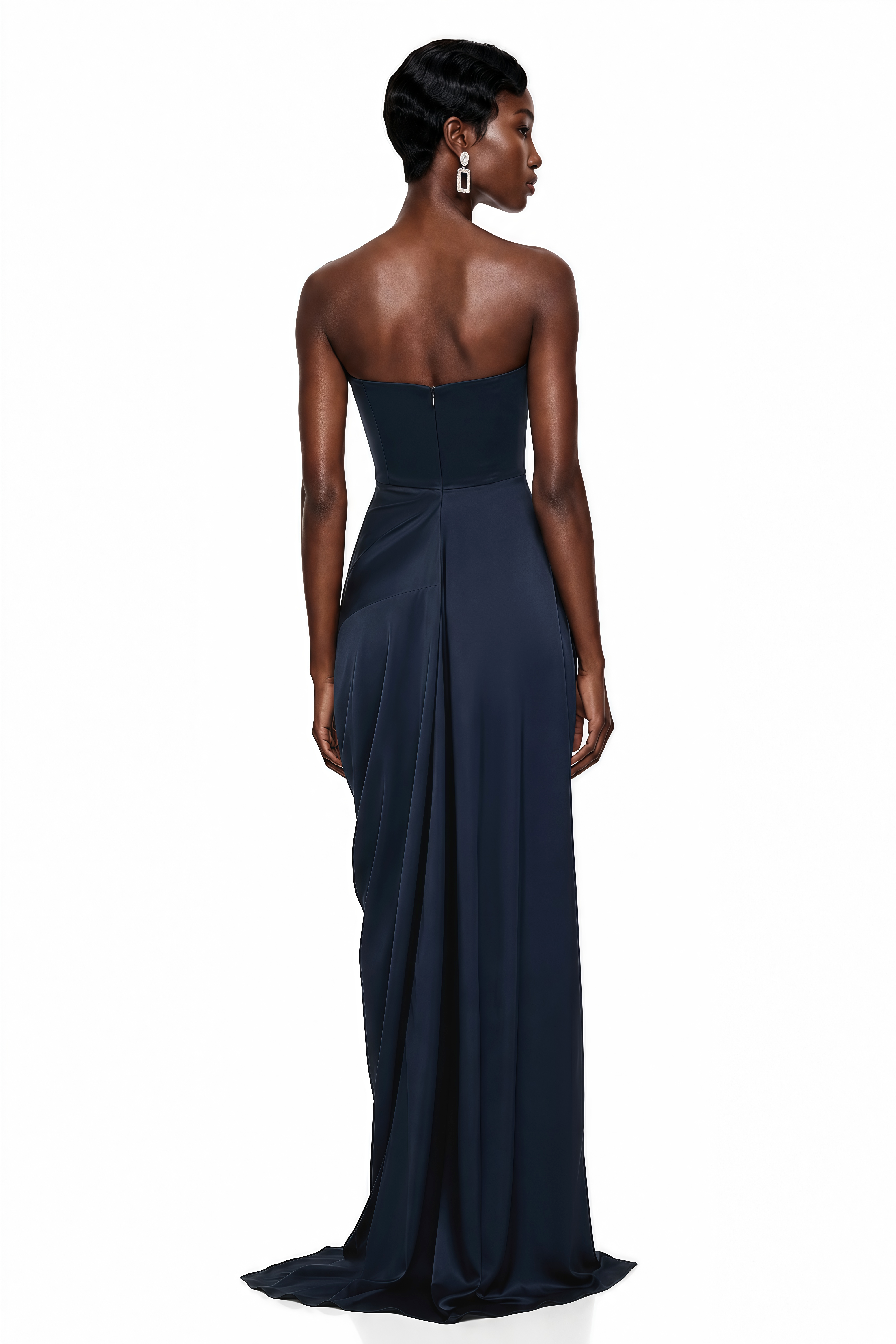 Navy blue strapless maxi dress with a fitted curved bodice, draped wrap skirt, and high thigh-high slit