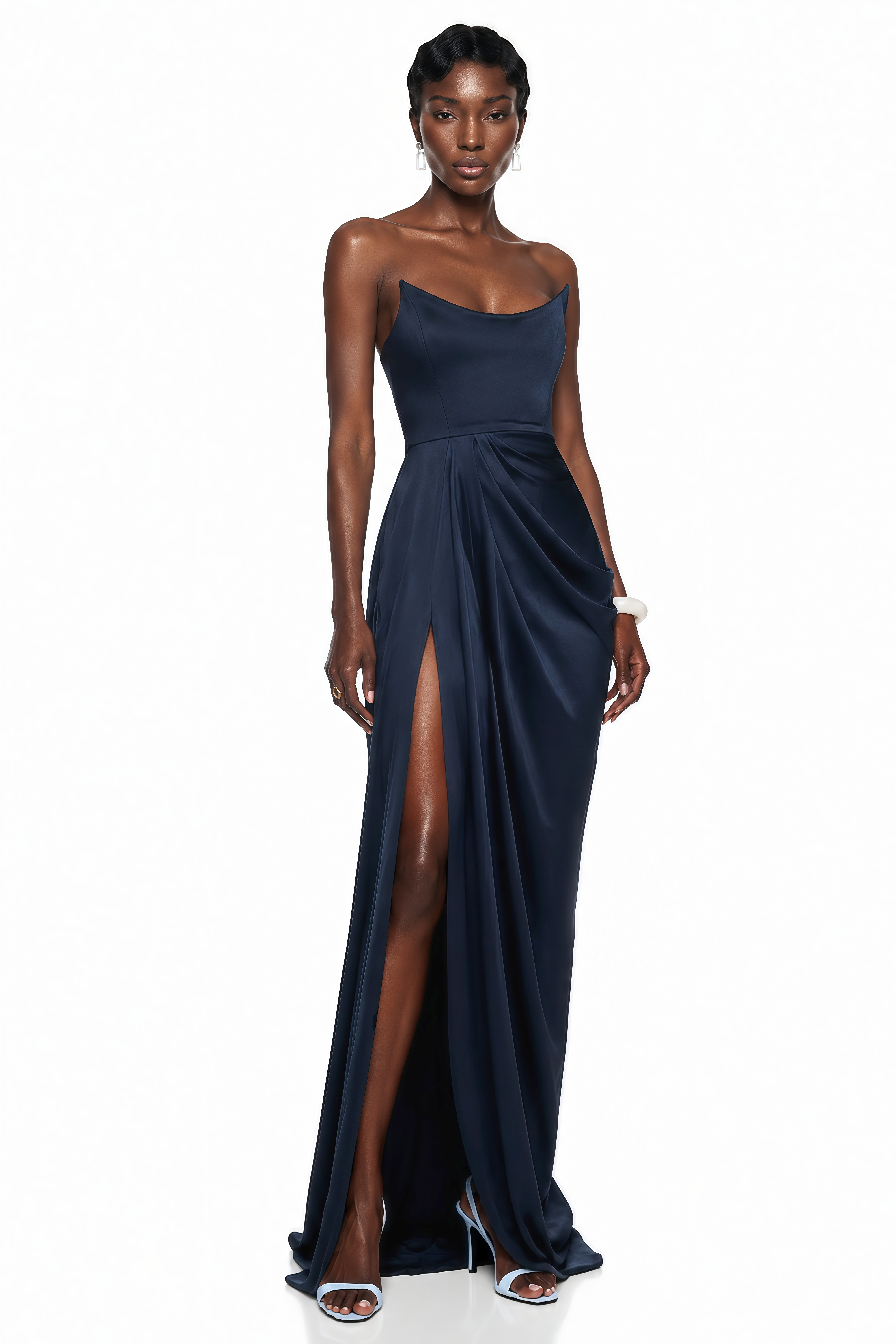 Navy blue strapless maxi dress with a fitted curved bodice, draped wrap skirt, and high thigh-high slit