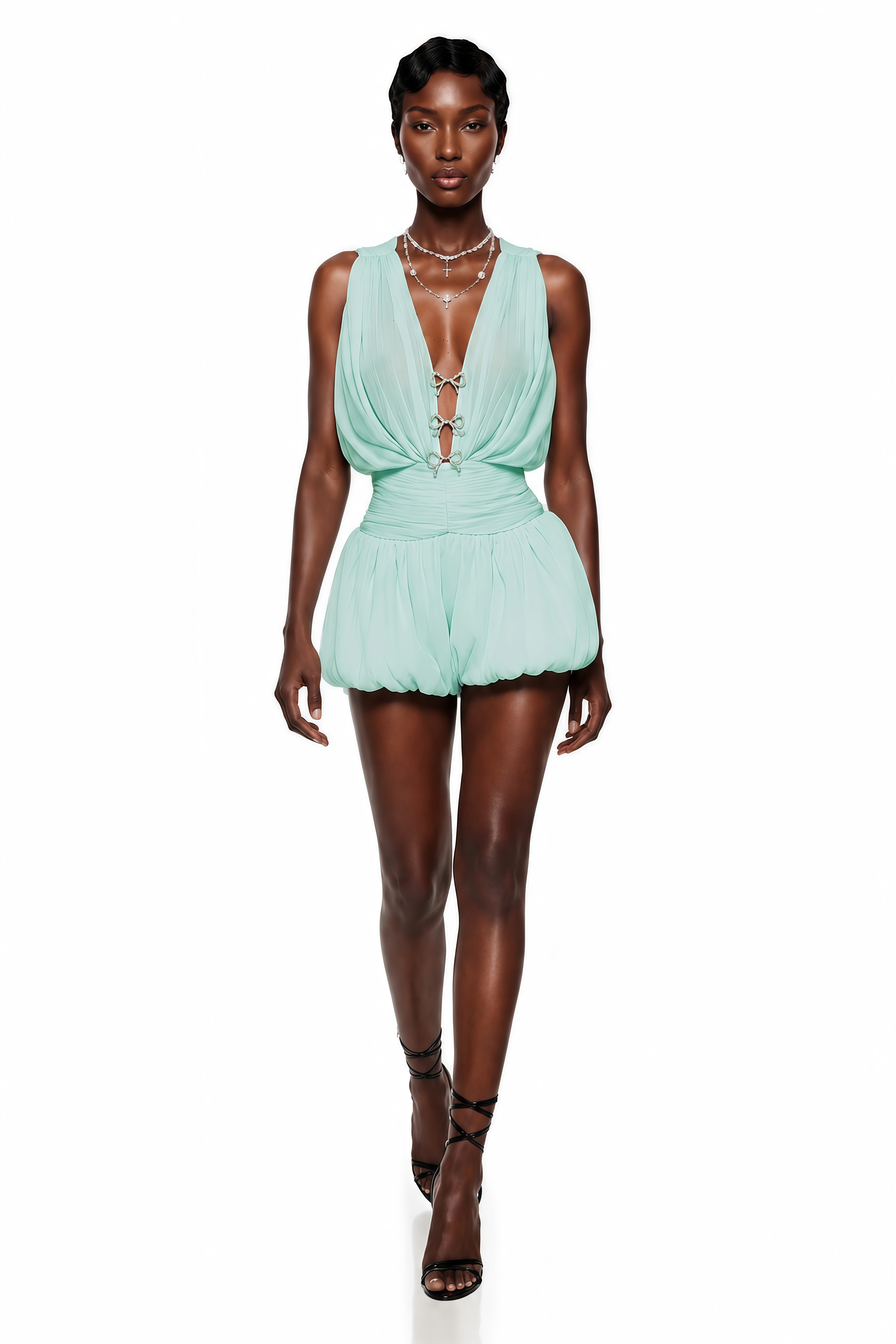 Mint green mini dress featuring a draped plunging V-neckline with bow closures, a ruched waistband, and a voluminous bubble skirt