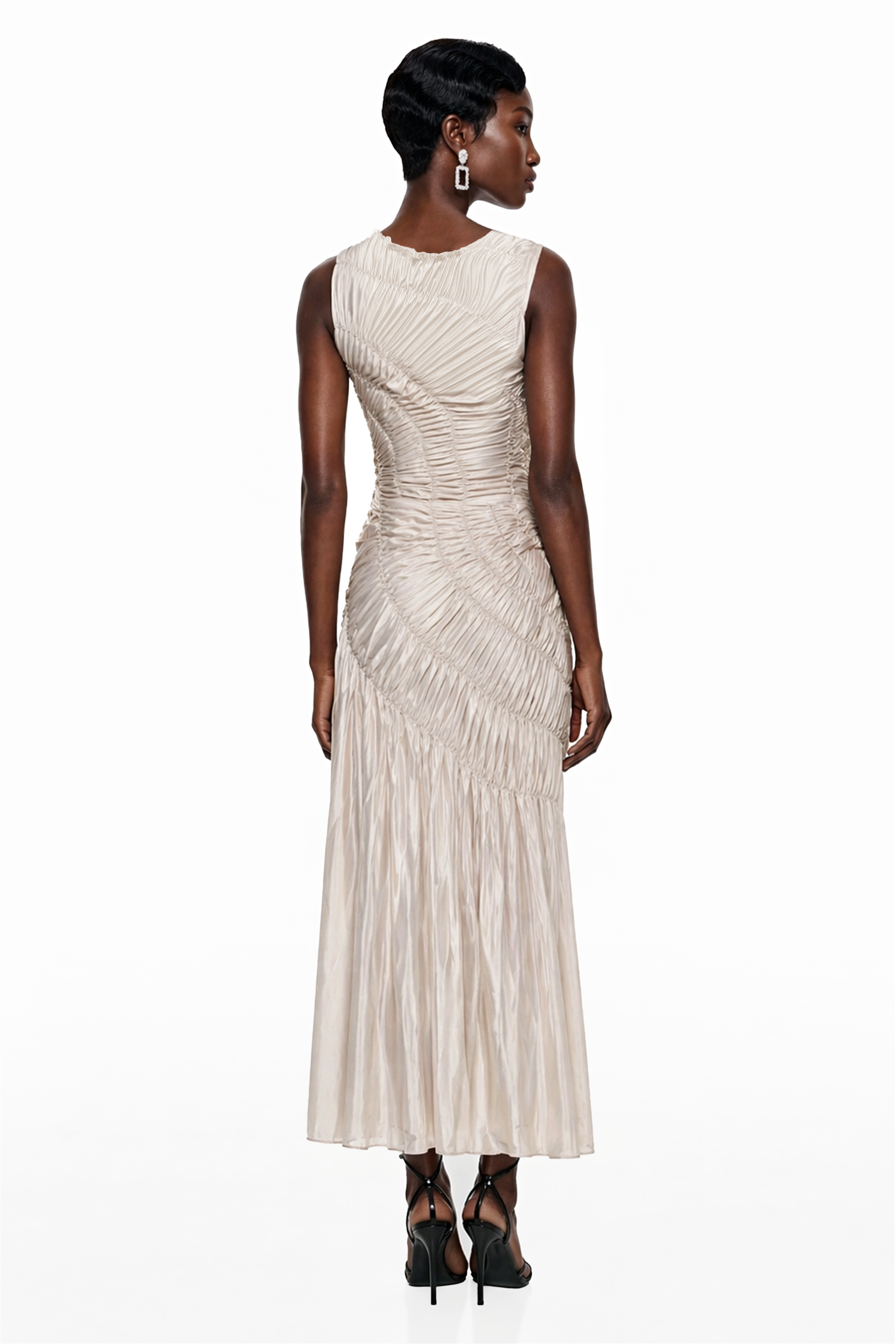 Champagne sleeveless maxi dress with diagonal ruched detailing and a pleated skirt