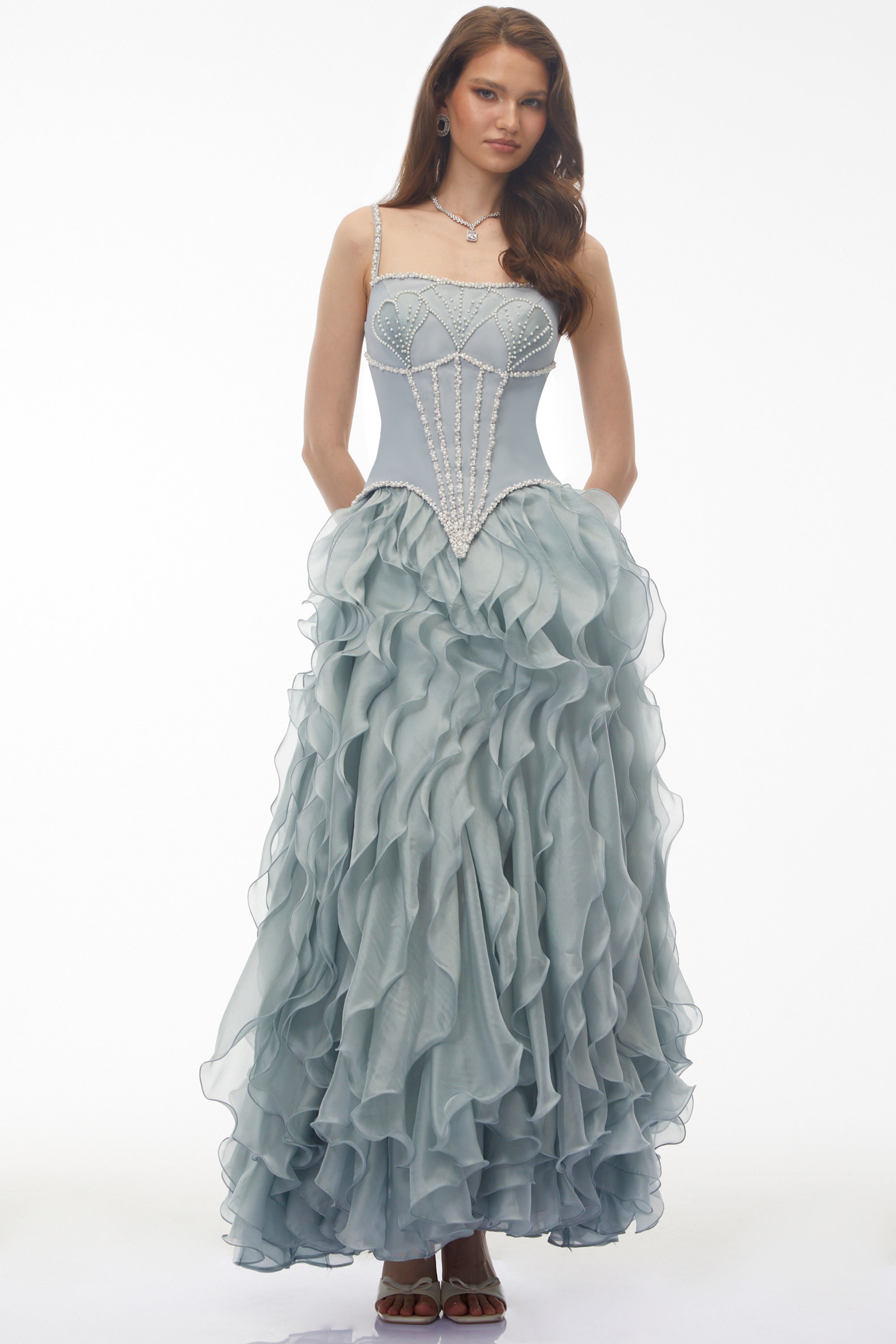 Dusty blue maxi dress with a pearl-embellished corset bodice and a tiered ruffled organza skirt