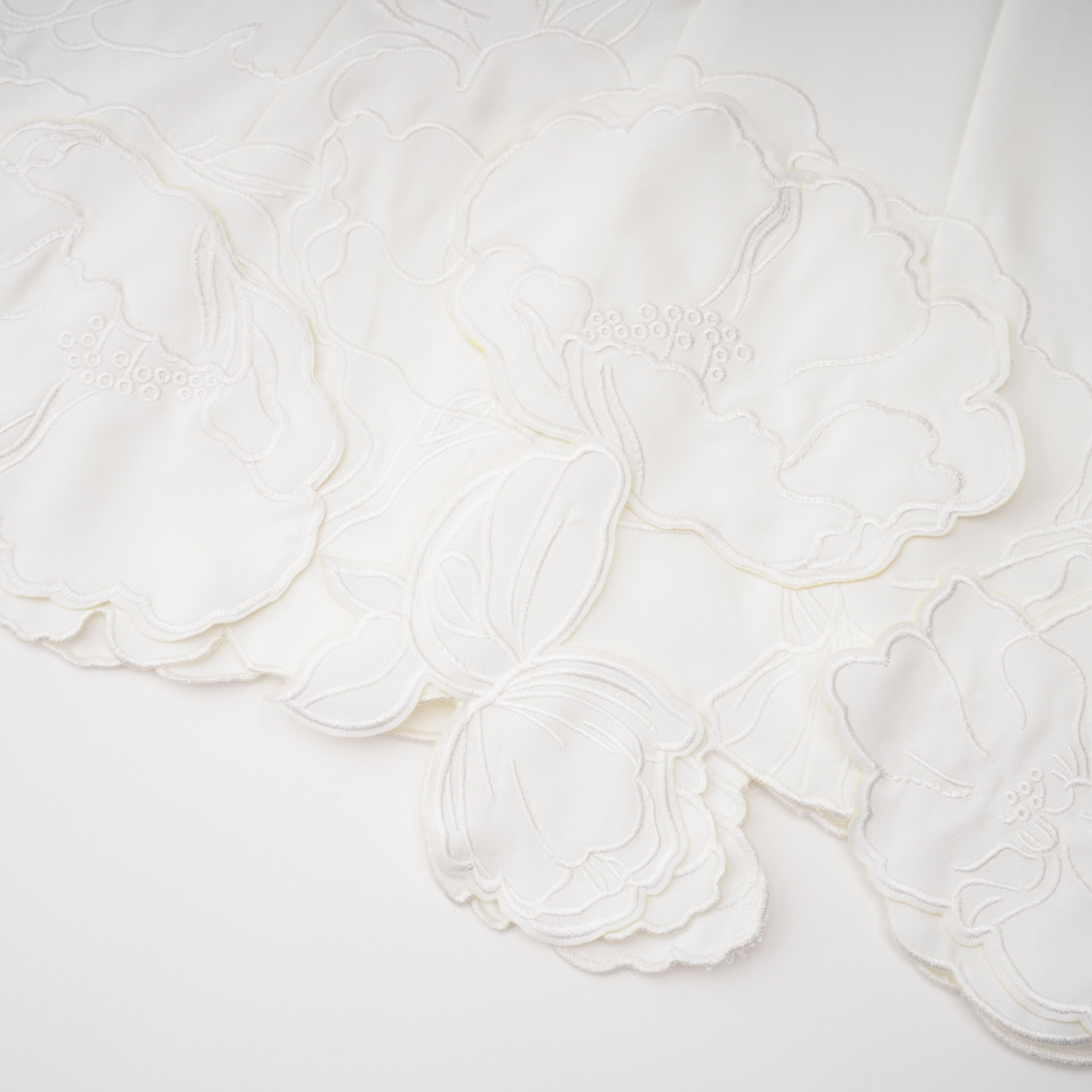 White strapless mini dress with 3D floral appliqués