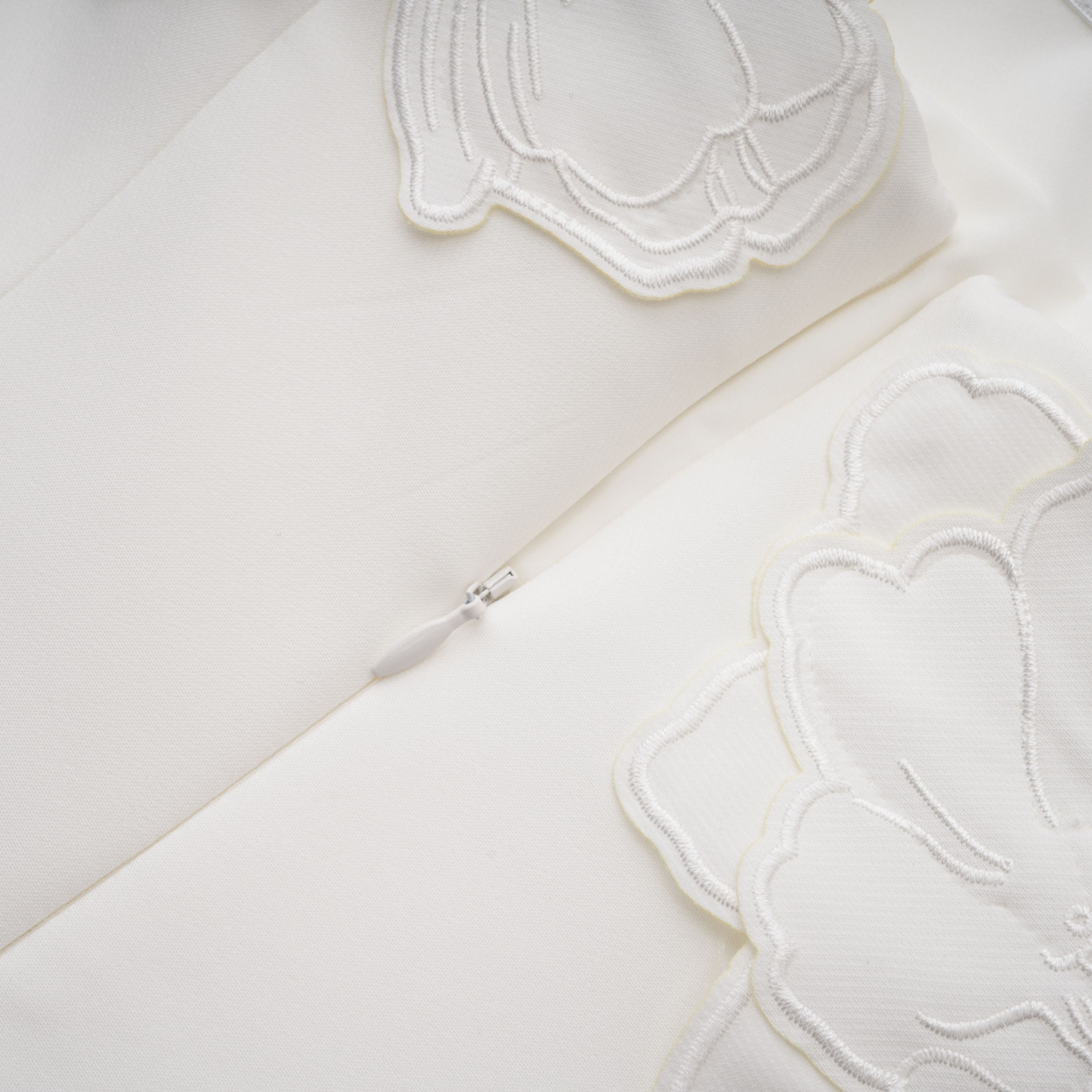 White strapless mini dress with 3D floral appliqués