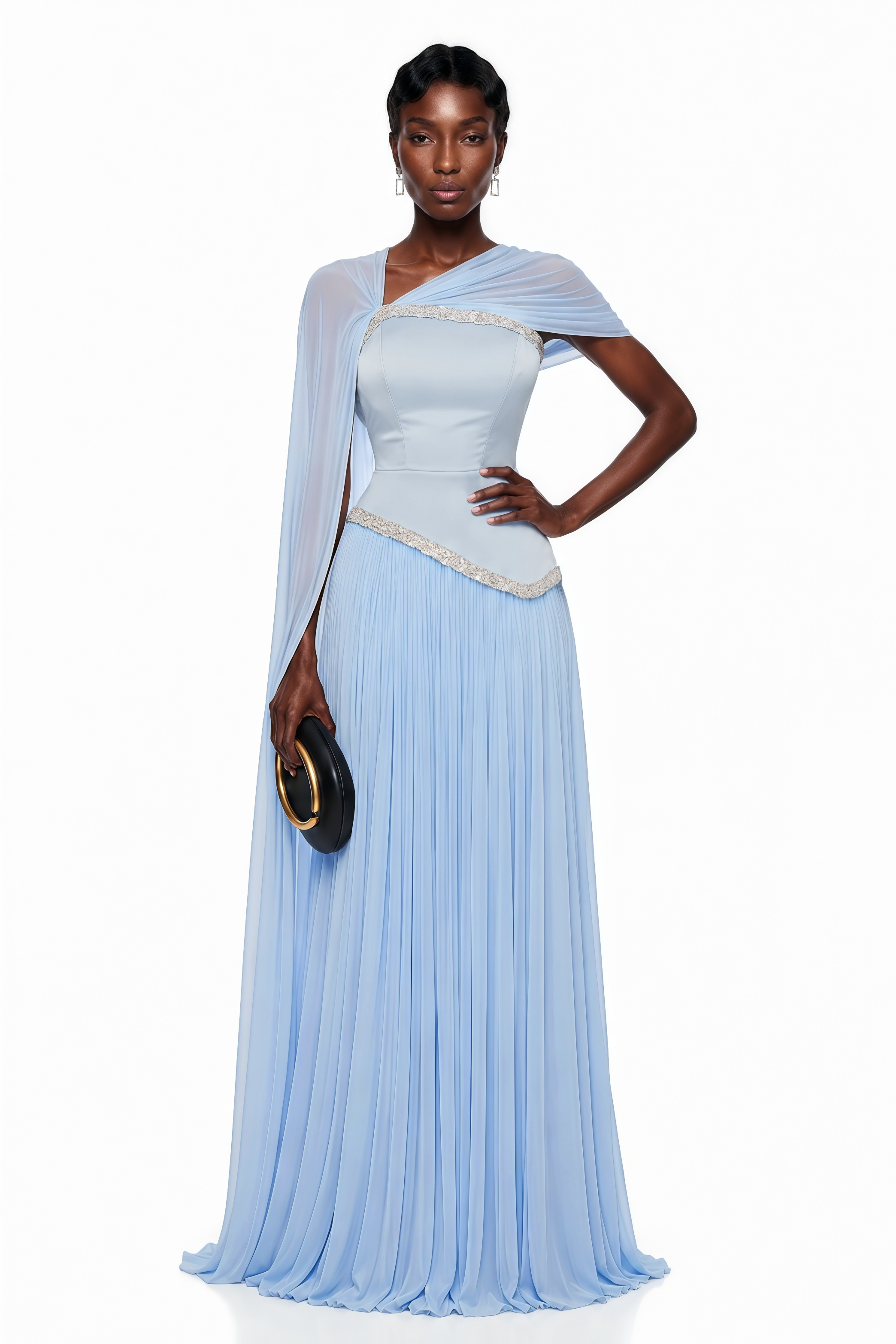 Light blue pleated gown with embellished trim and draped cape