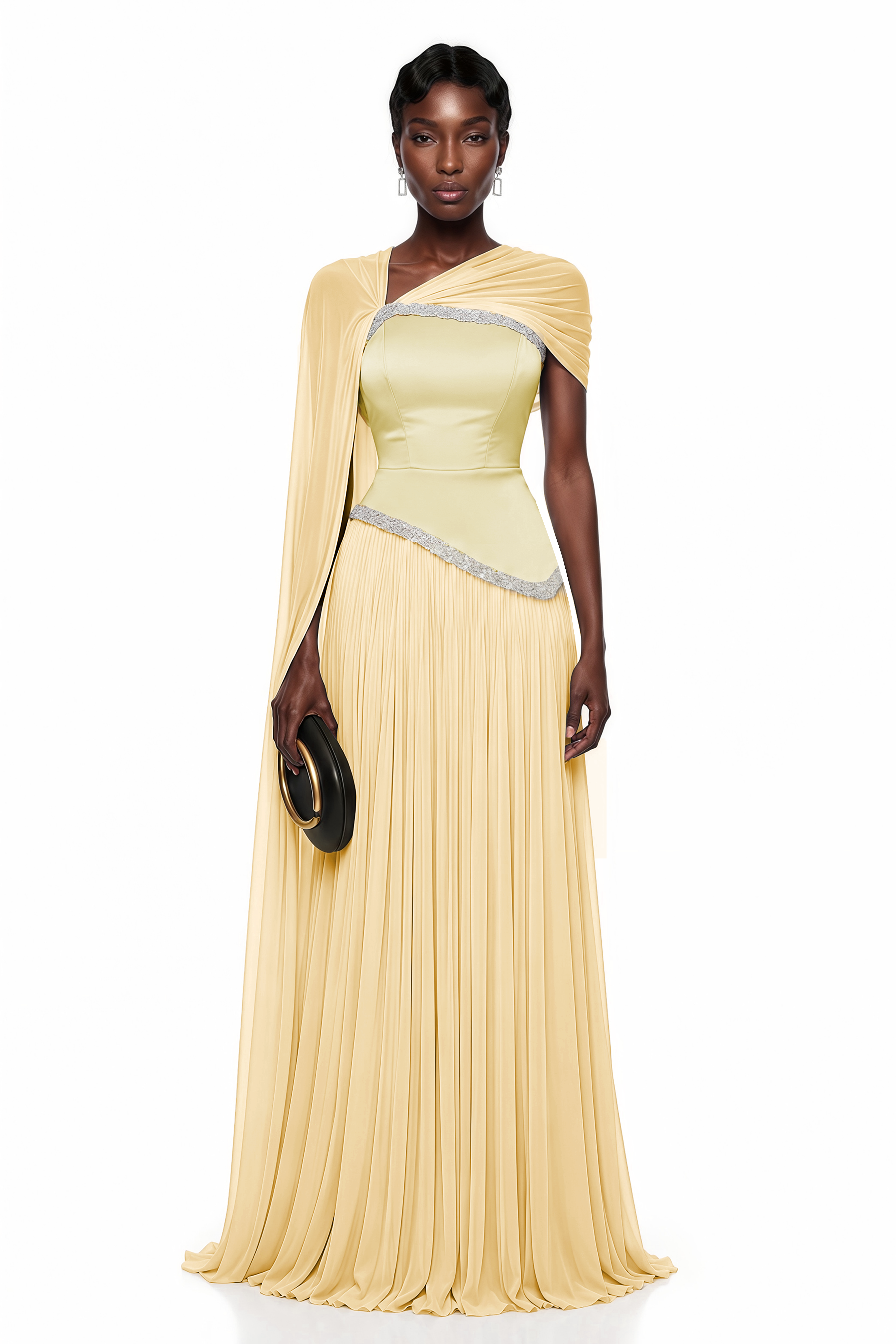 Pale yellow pleated gown with embellished trim and draped cape