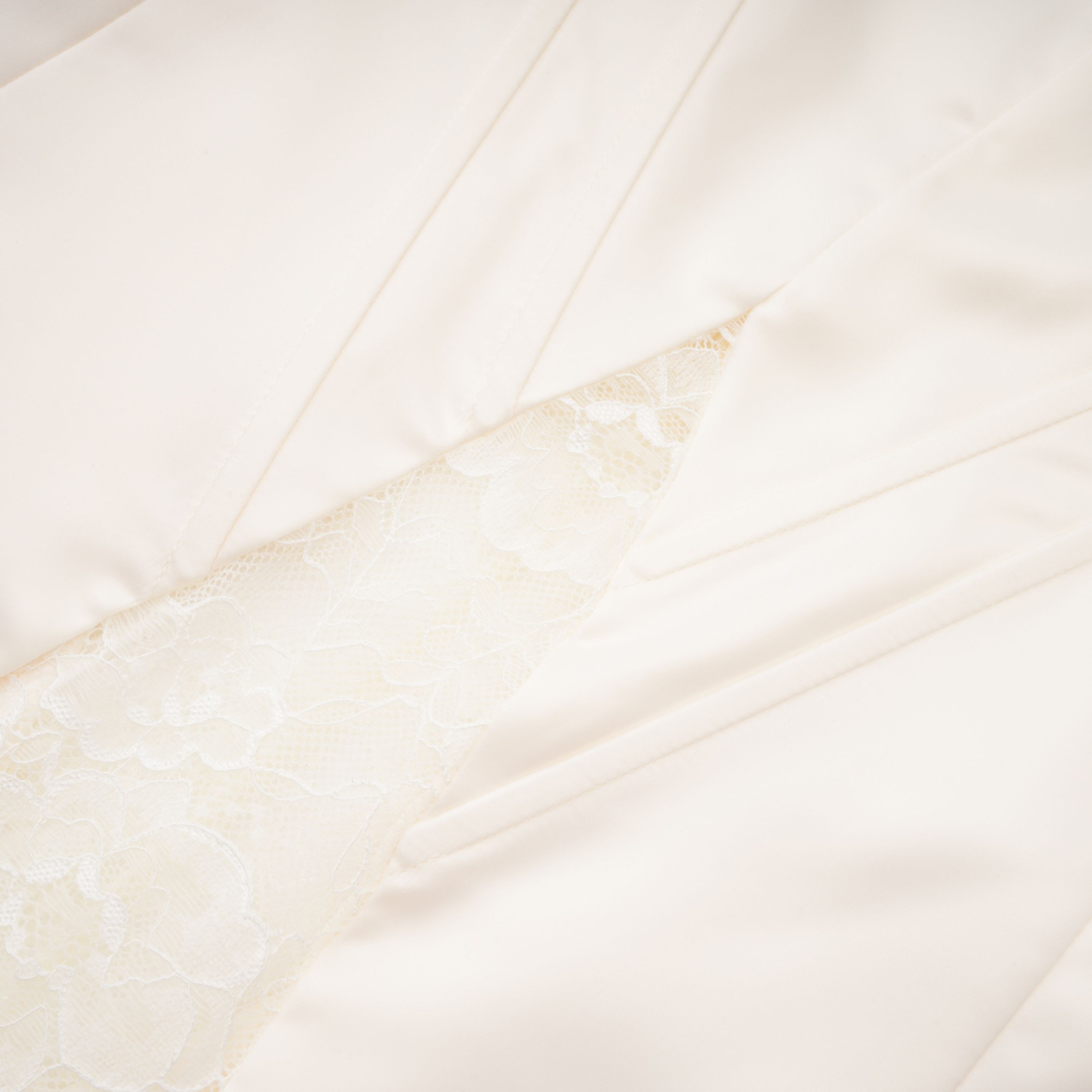 White satin corset mini dress with lace inserts and trim