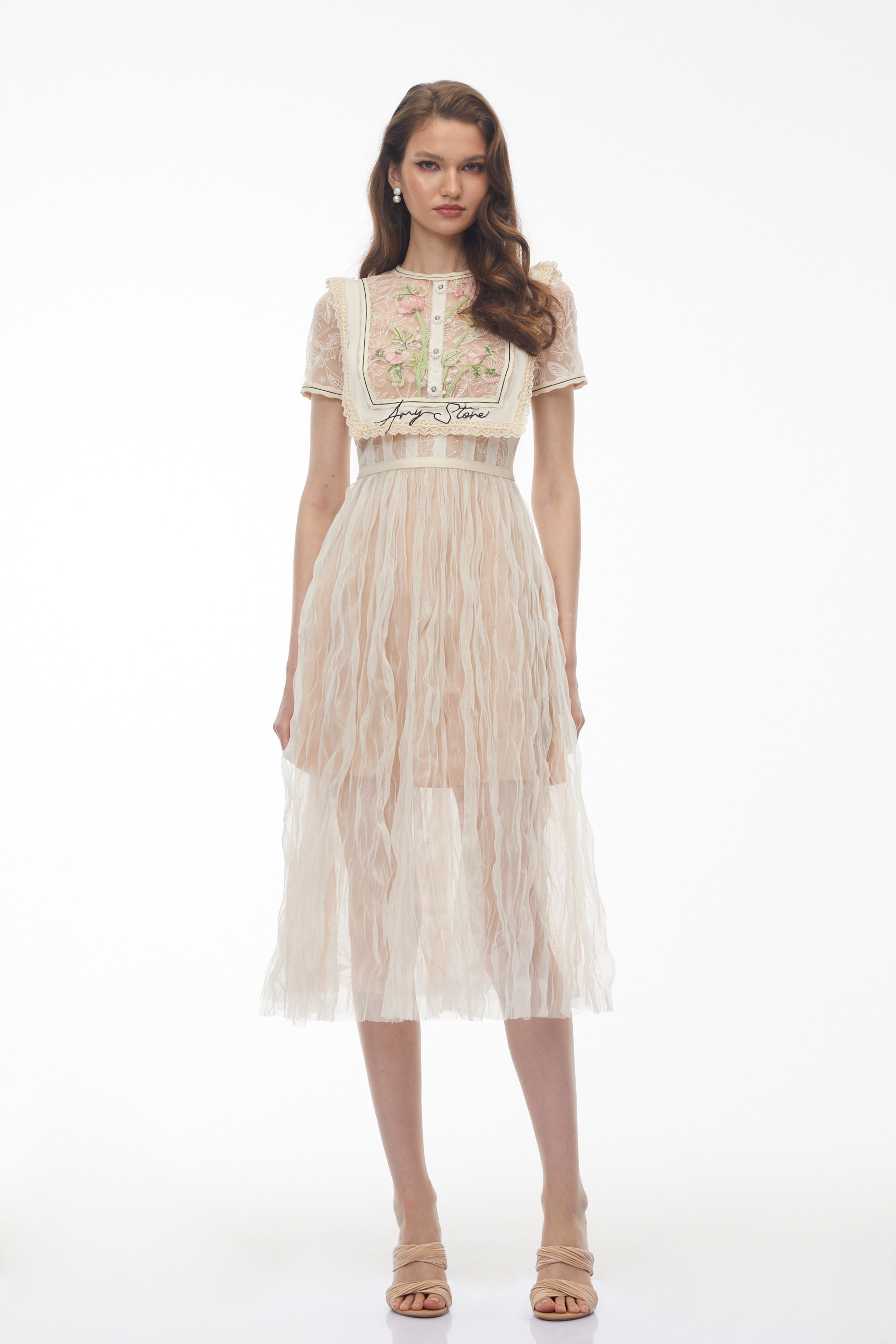 Beige lace midi dress with floral embroidery and bib detail