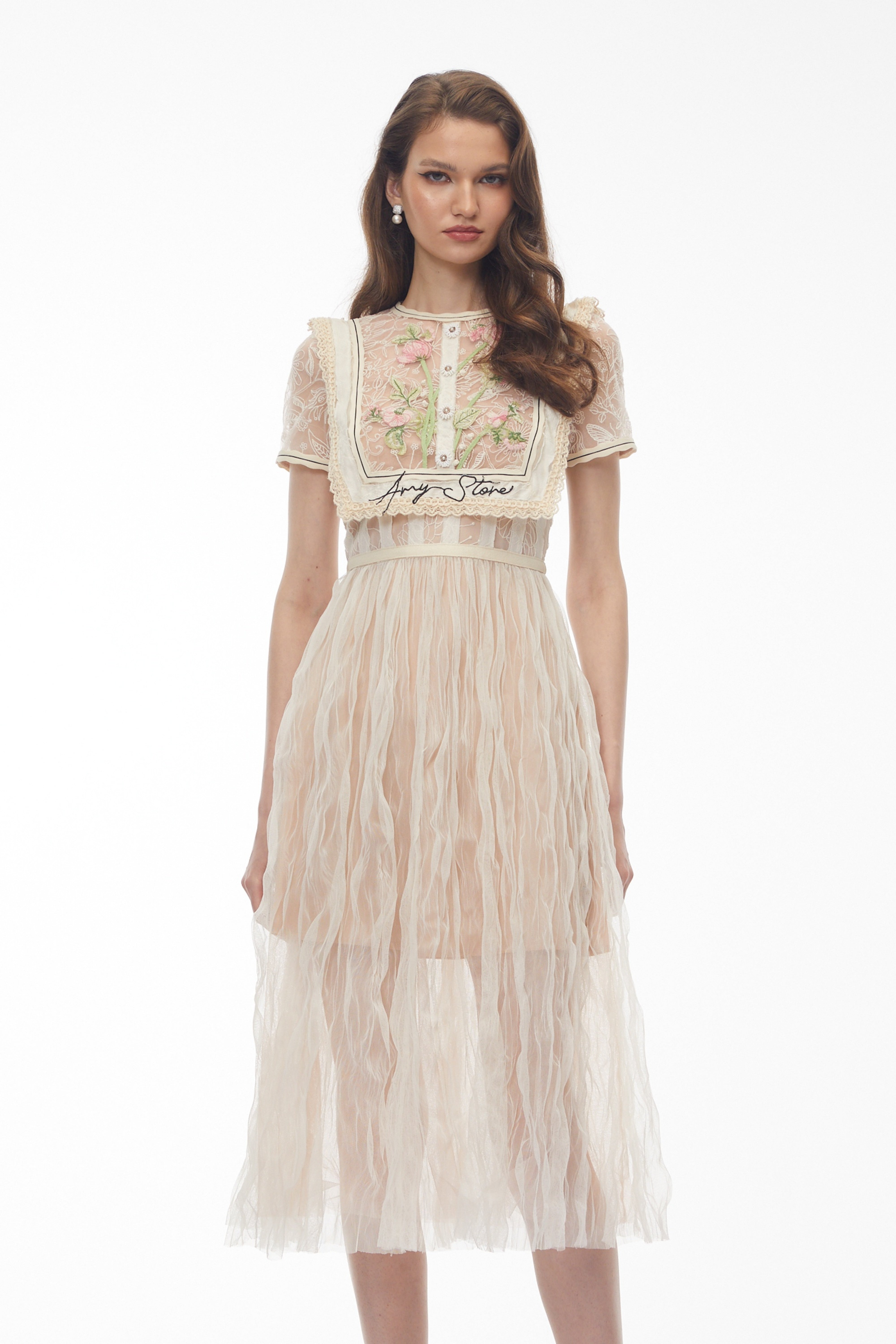 Beige lace midi dress with floral embroidery and bib detail