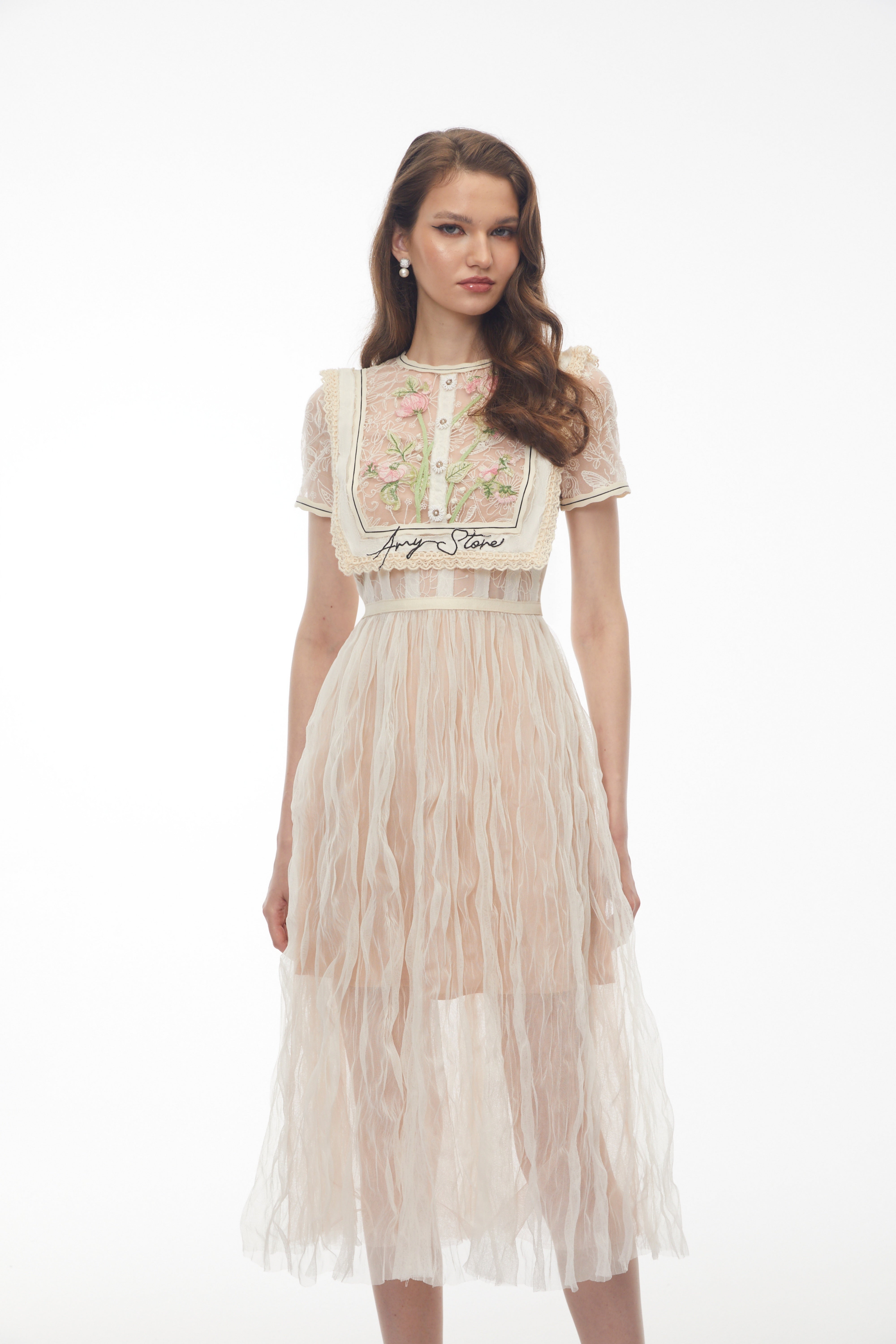 Beige lace midi dress with floral embroidery and bib detail